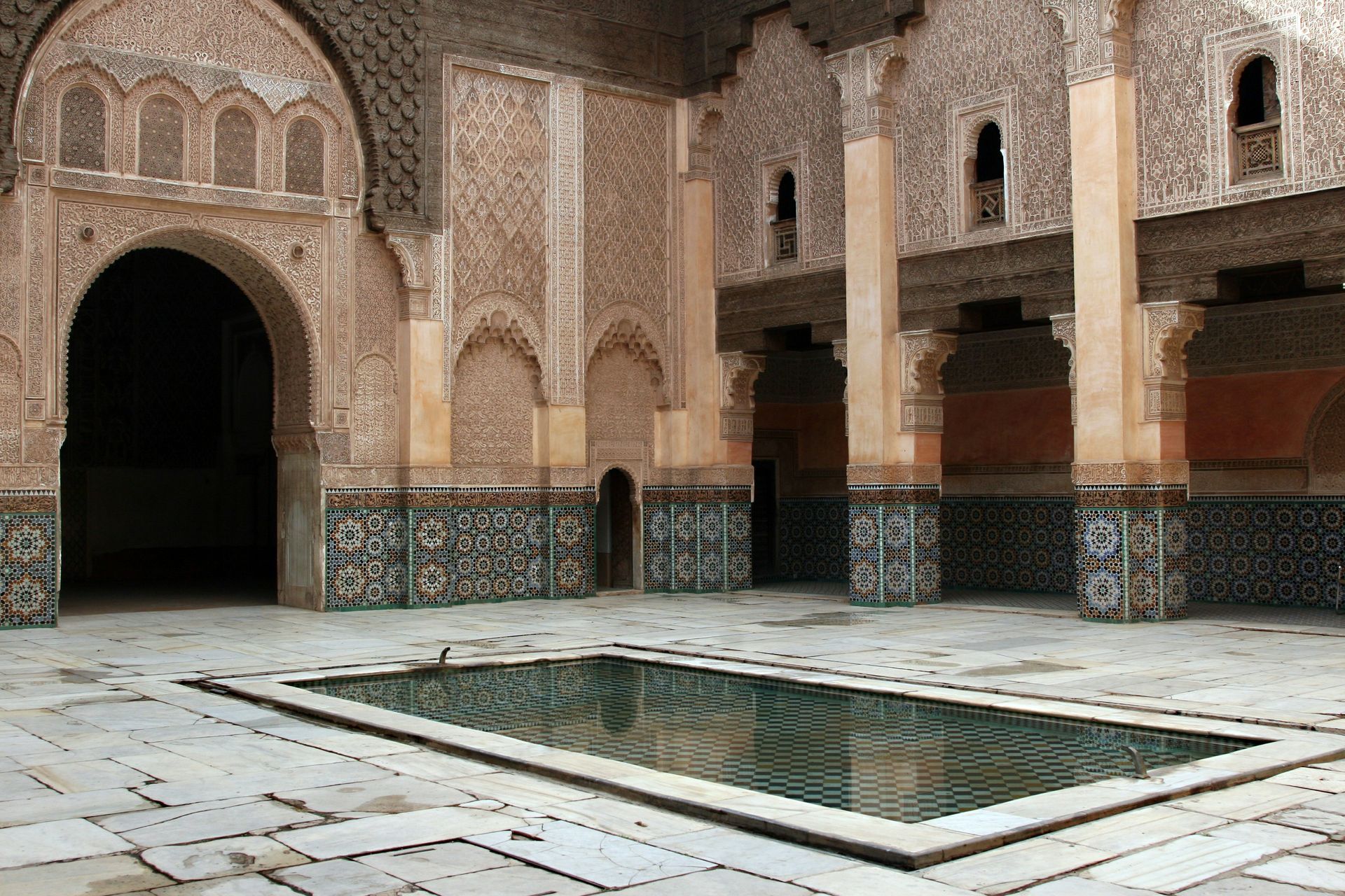 A large riad with a pool in the middle of it in Marrakesh, Morocco.