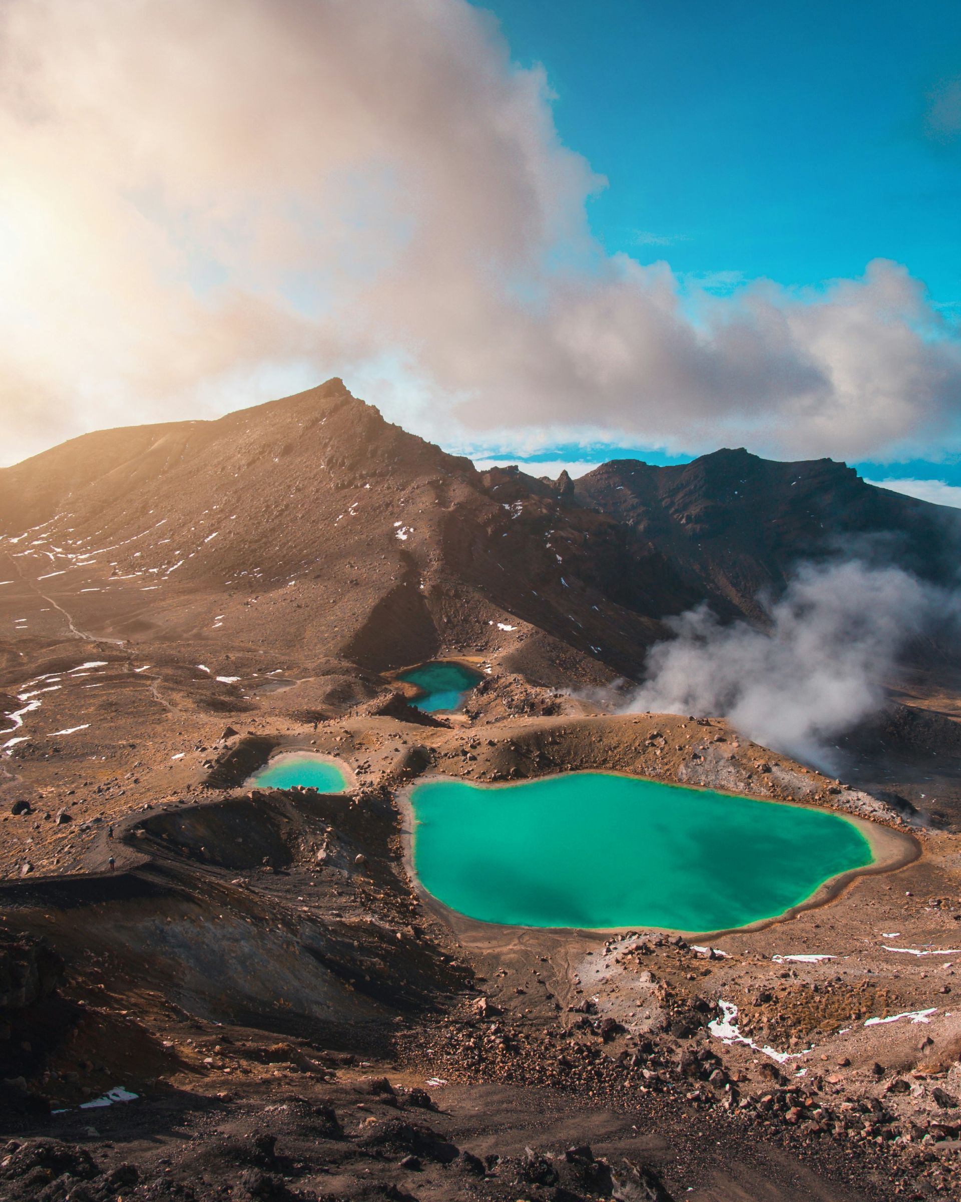 There are two small lakes in the middle of a mountain in Tongariro National Park, New Zealand.