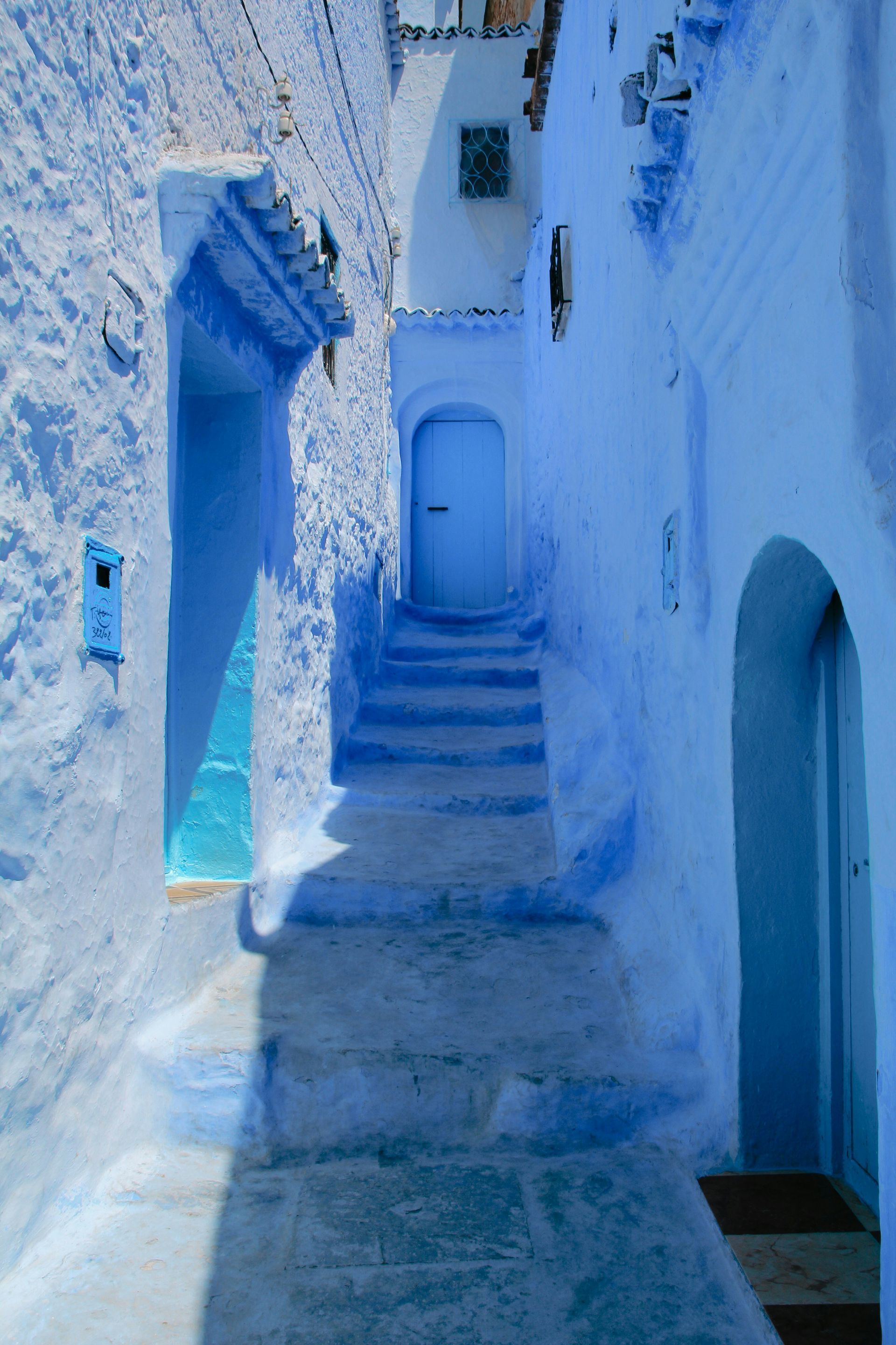 A blue building with stairs leading up to it in Chefchaouen, Morocco.