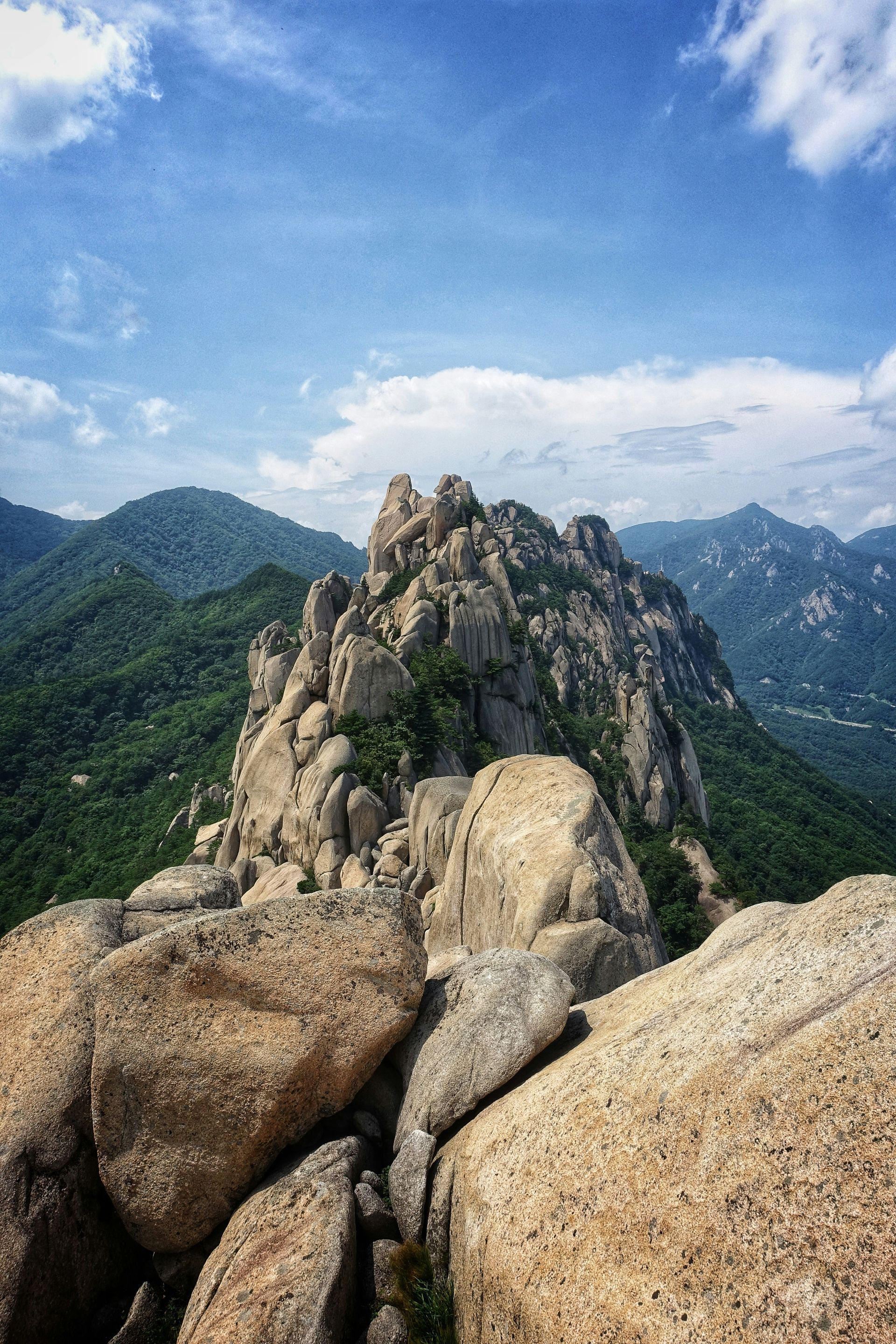 Rocky mountain peak with blue sky and green in Seoraksan National Park, South Korea.
