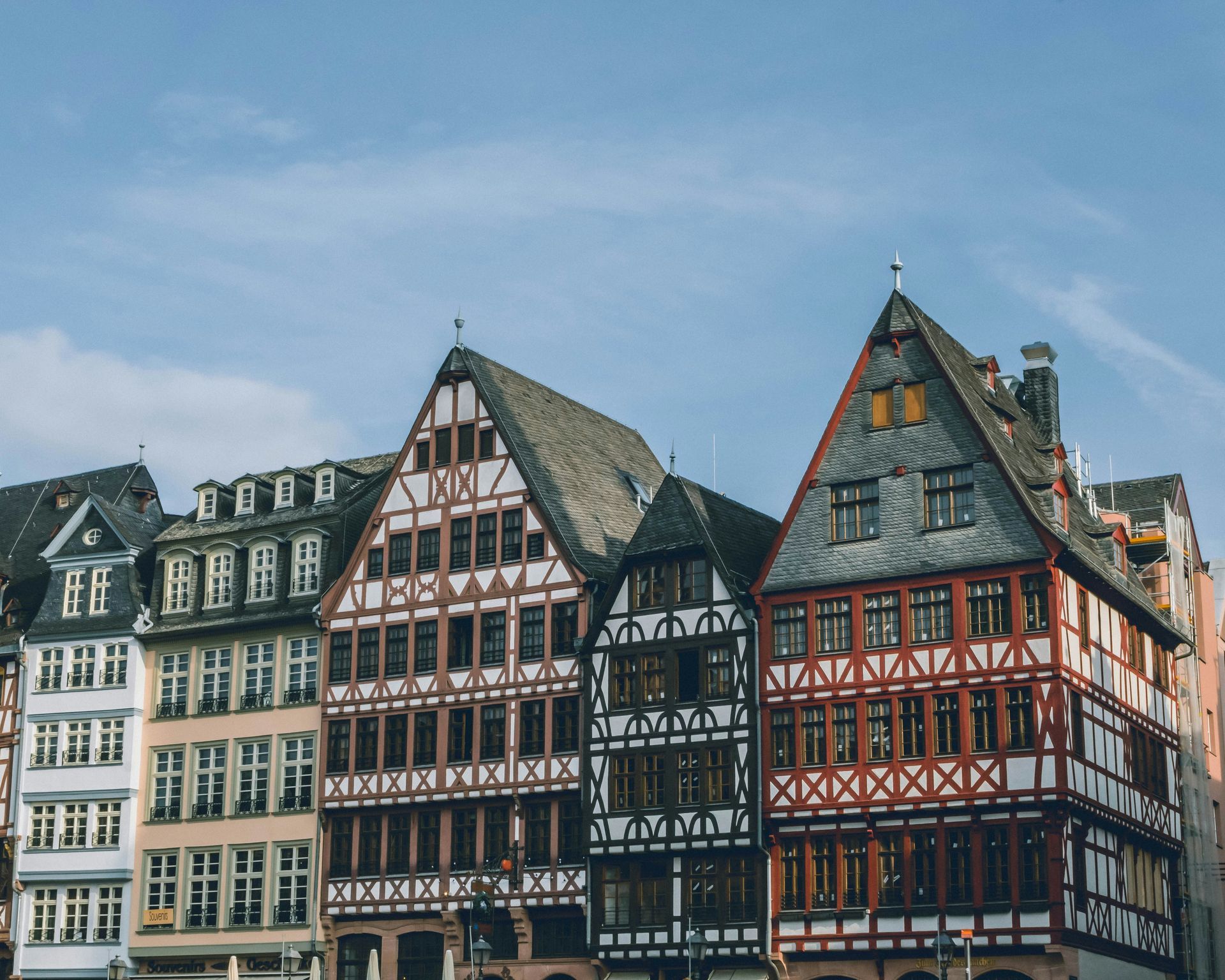 Row of colorful half-timbered houses with gabled roofs in Frankfurt, Germany.