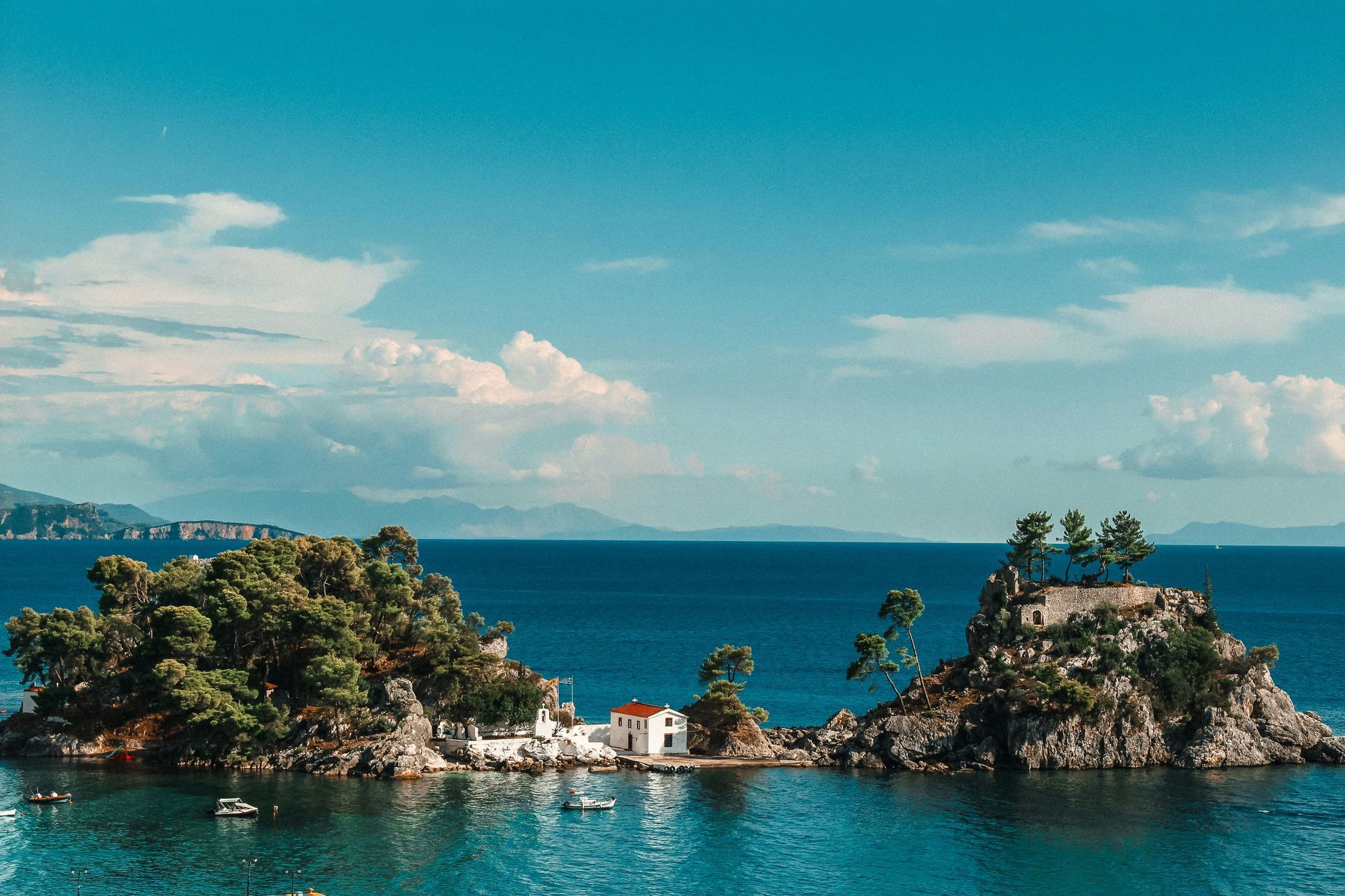 There are two small islands in the middle of the ocean in Parga, Greece.