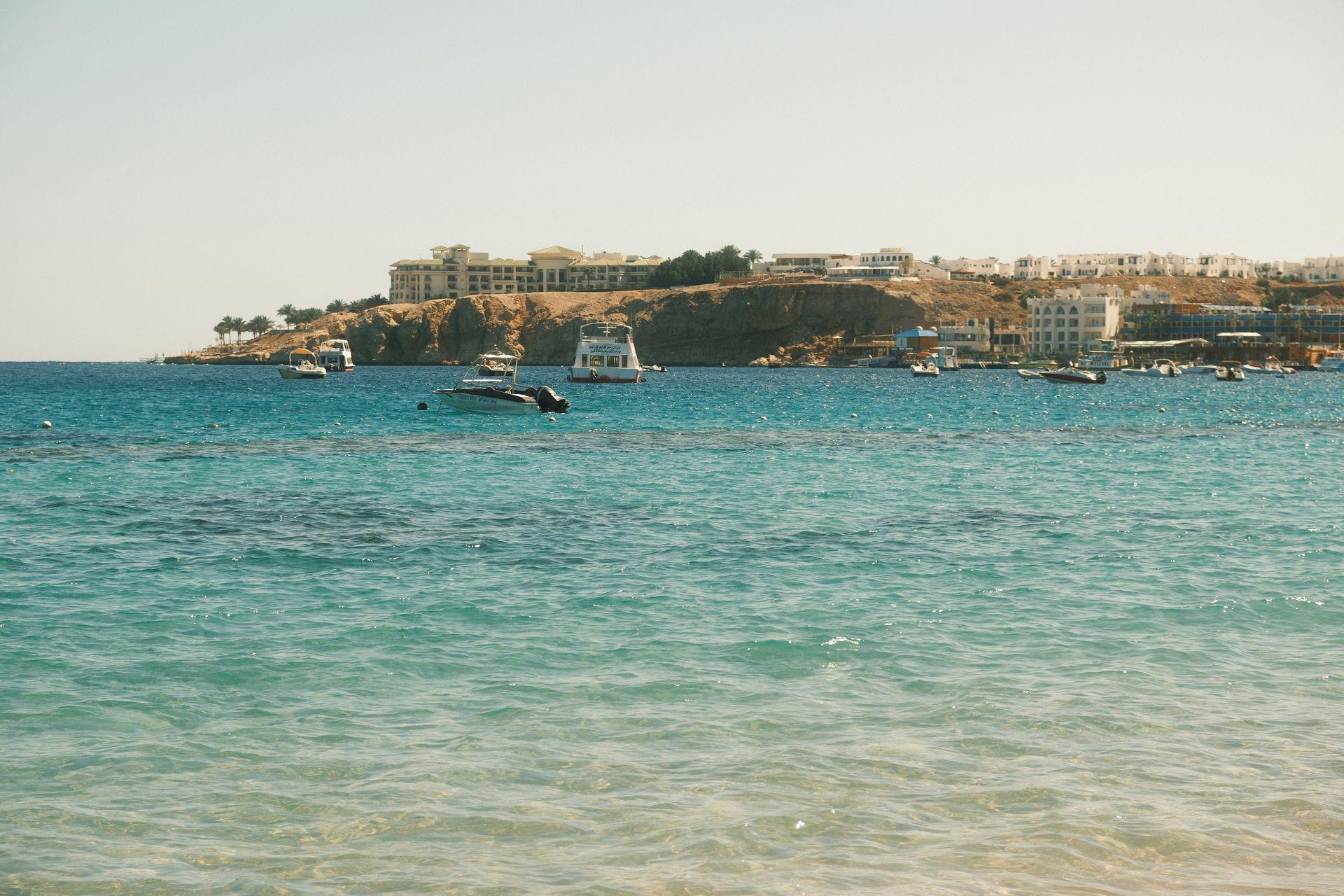 A large body of water with boats in it in Sharm El-Sheikh, Egypt.