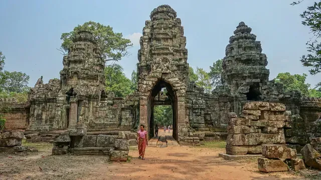 Ancient stone temple entrance, Cambodia. A person stands in the doorway in Siem Reap.