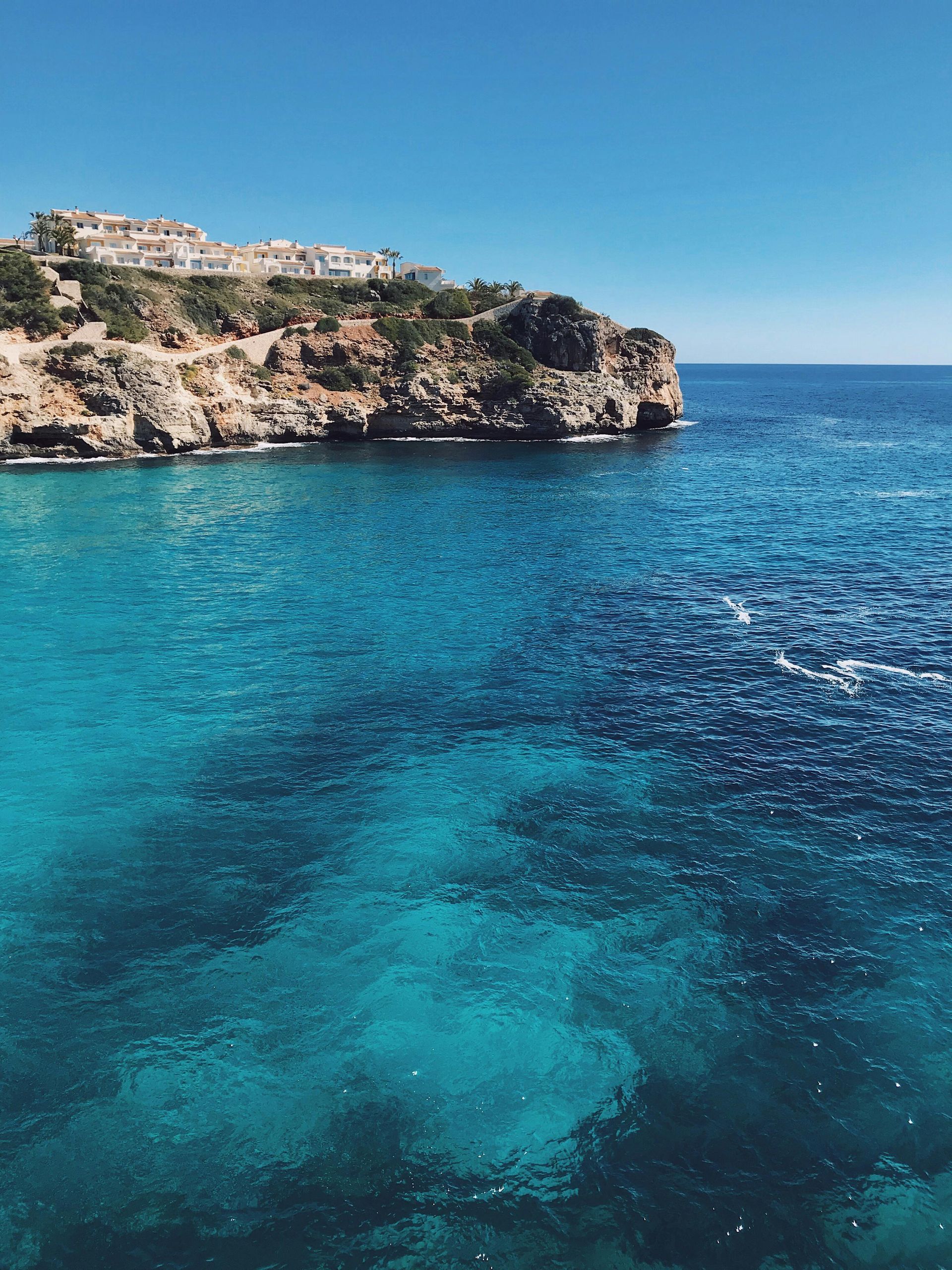 the Mediterranean with a cliff in the background