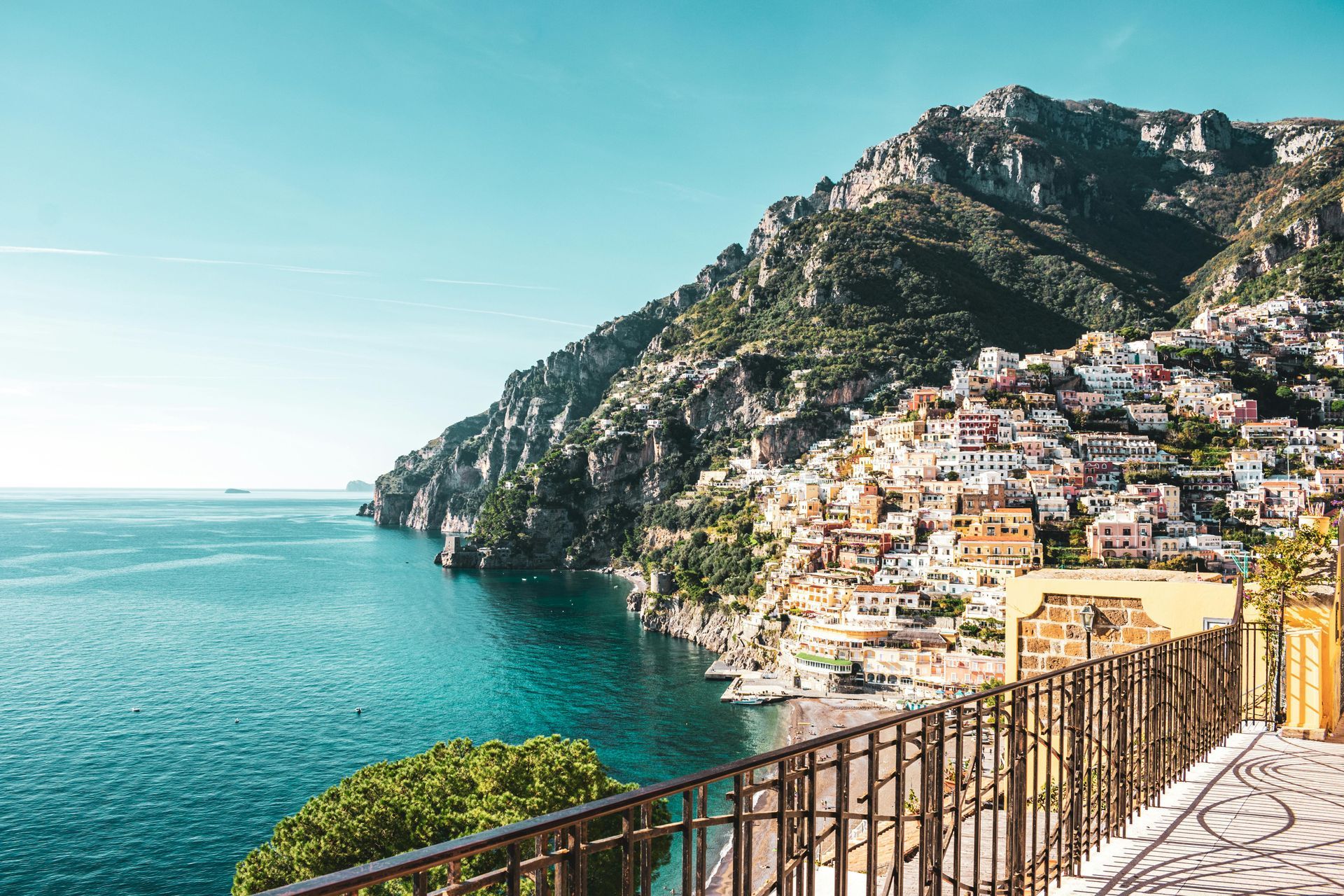 A view of the Amalfi Coast on a hill overlooking the ocean from a balcony in Italy.