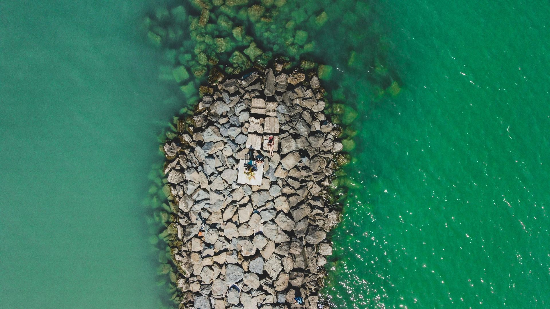 An aerial view of a pier in the middle of the ocean on Seychelles  Island.