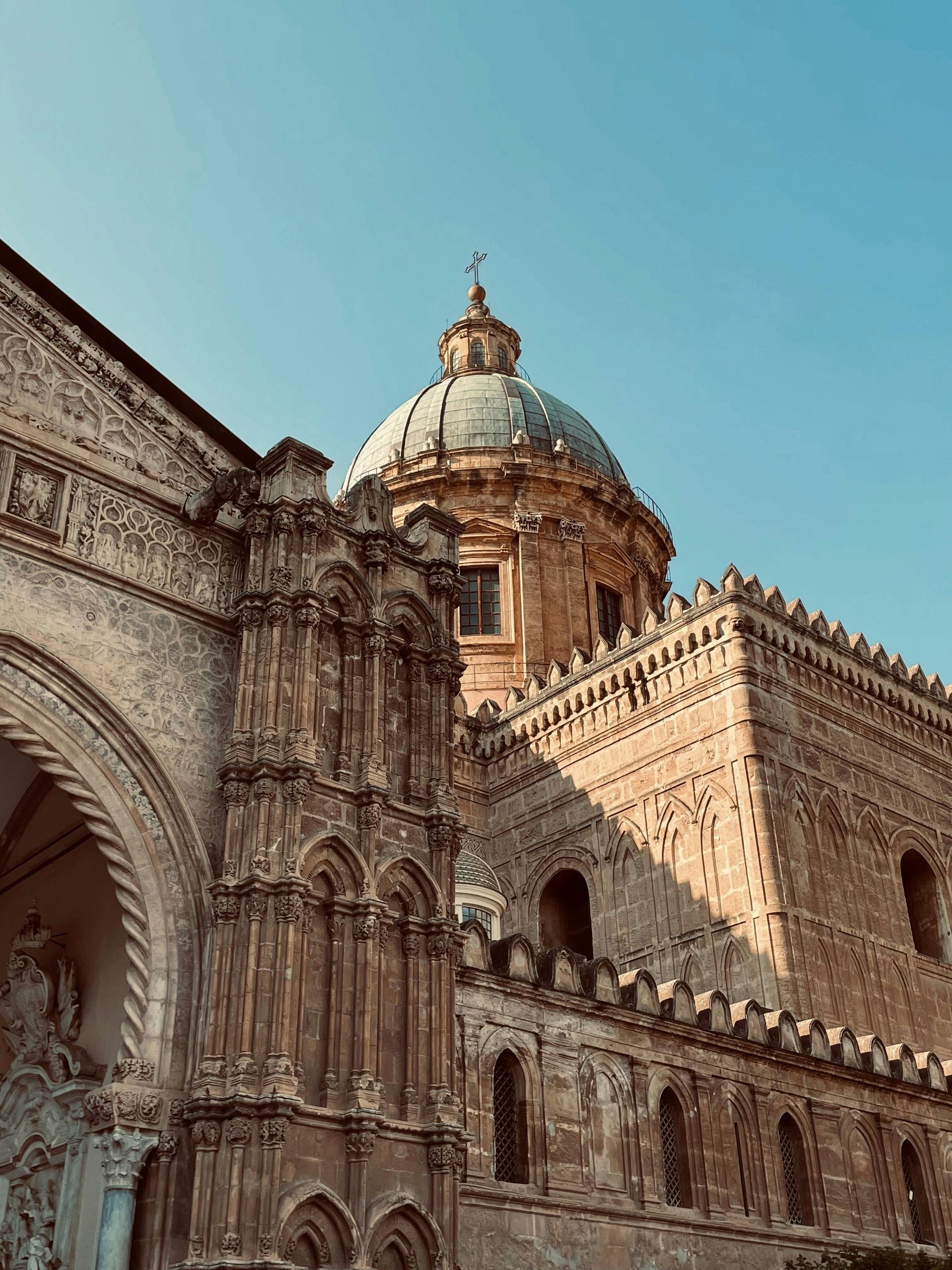 A large building with a dome on top of it in Sicily, Italy.