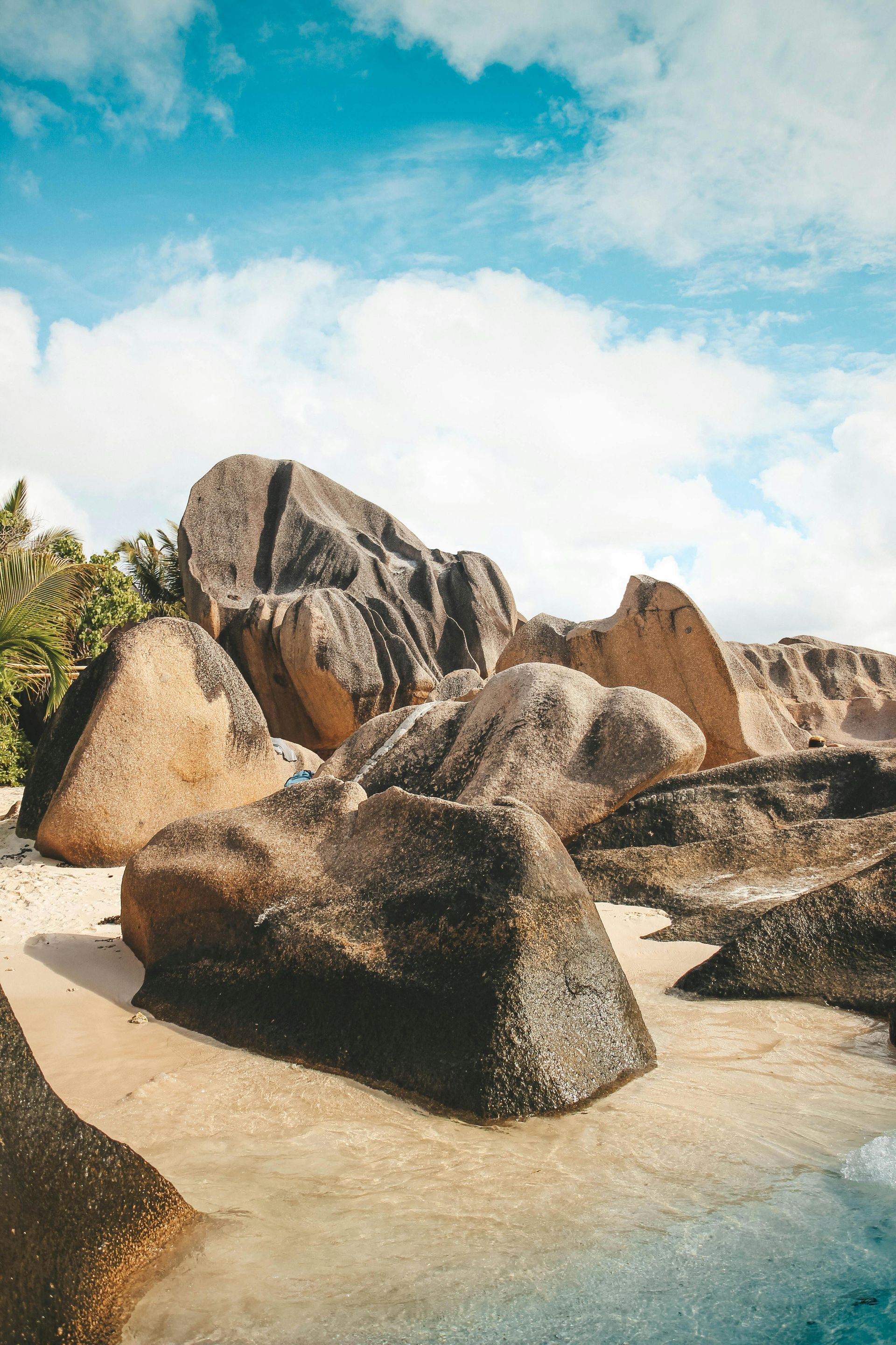 There are a lot of rocks on the beach on Seychelles Island.