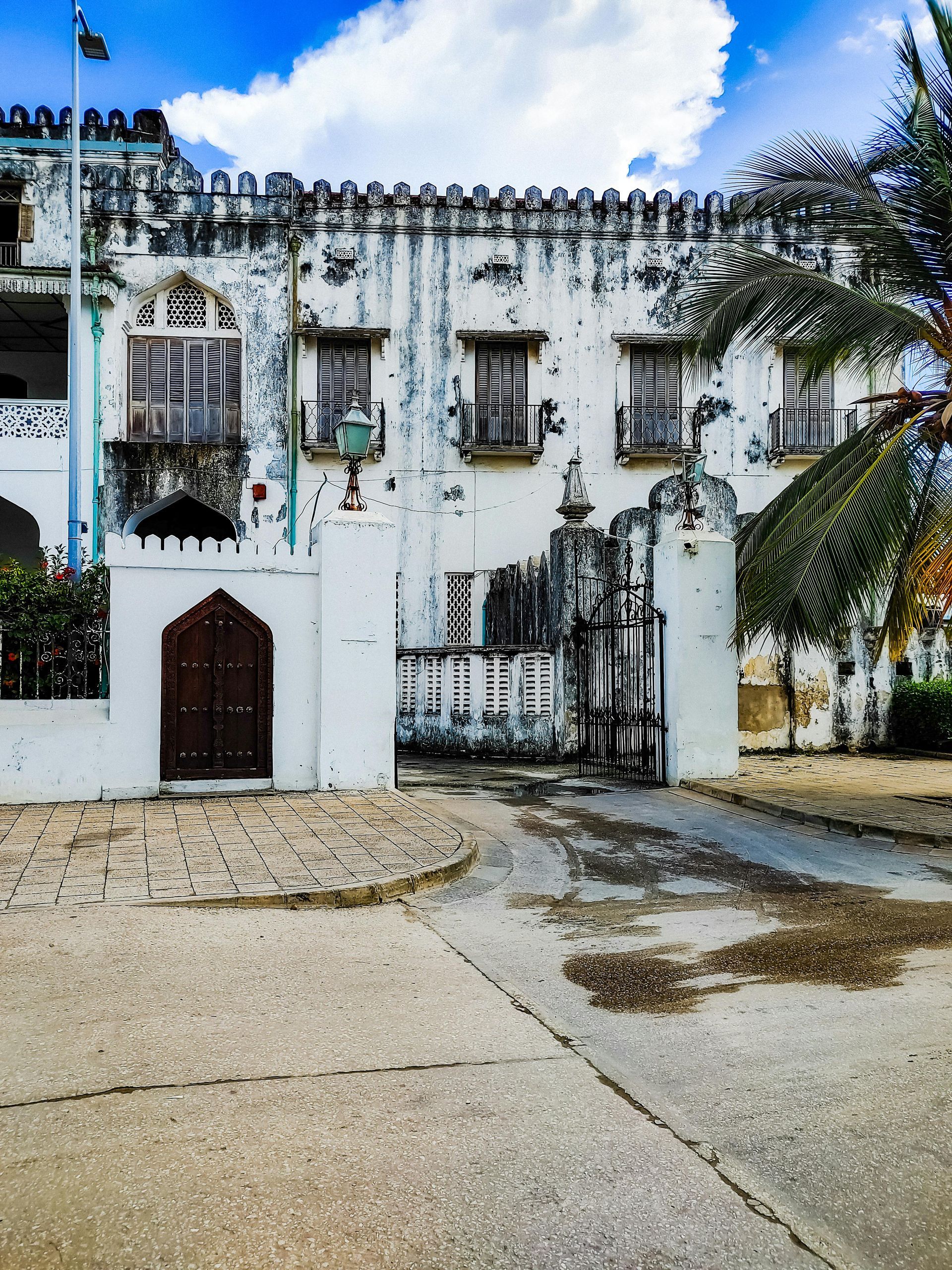 A large white building with a lot of windows in Tanzania, Africa.