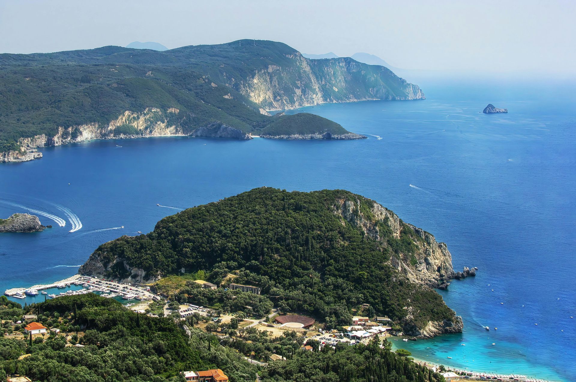 An aerial view of a small island in the middle of the ocean in Corfu, Greece.