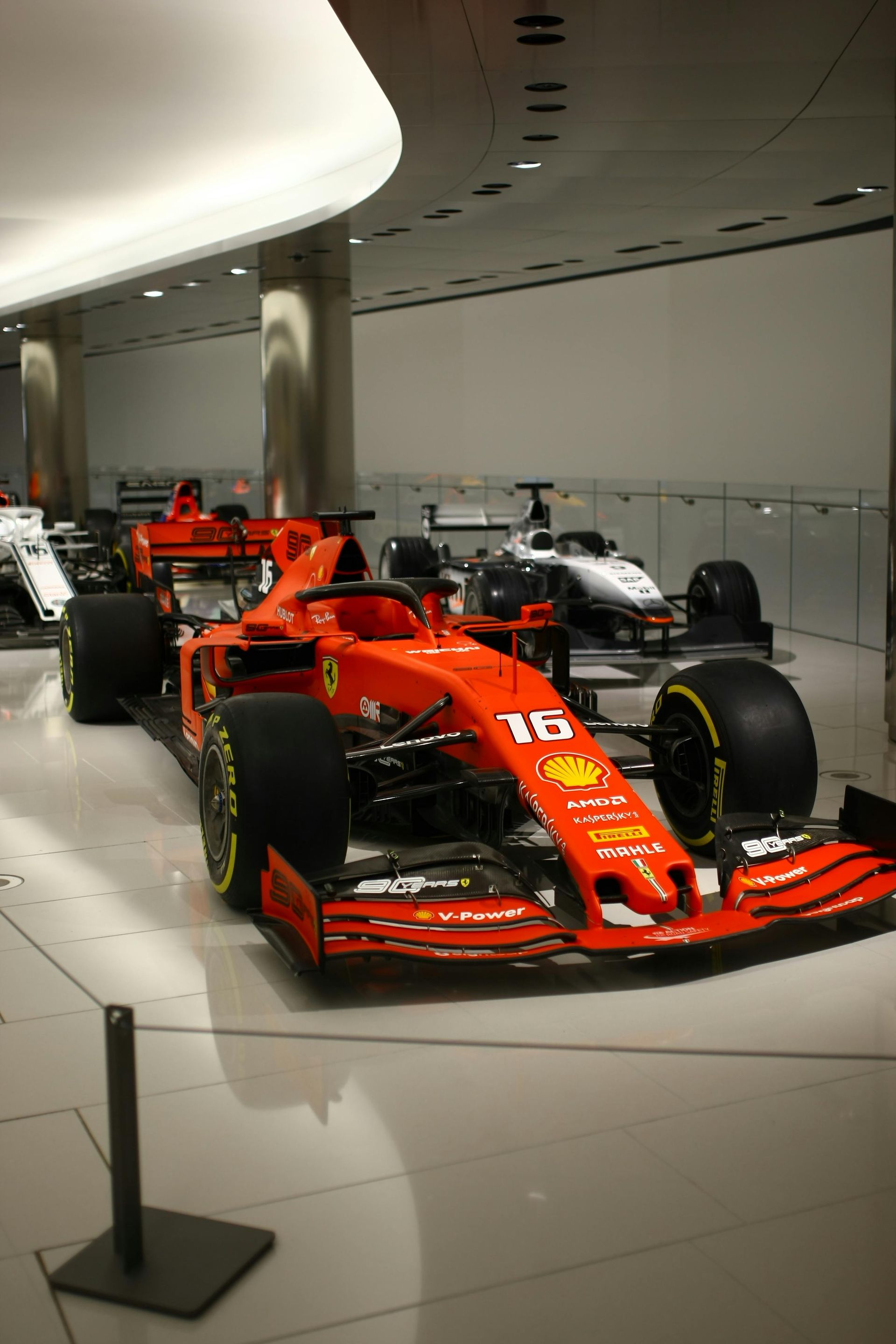 A red formula 1 race car with the number 15 on it in Monaco.