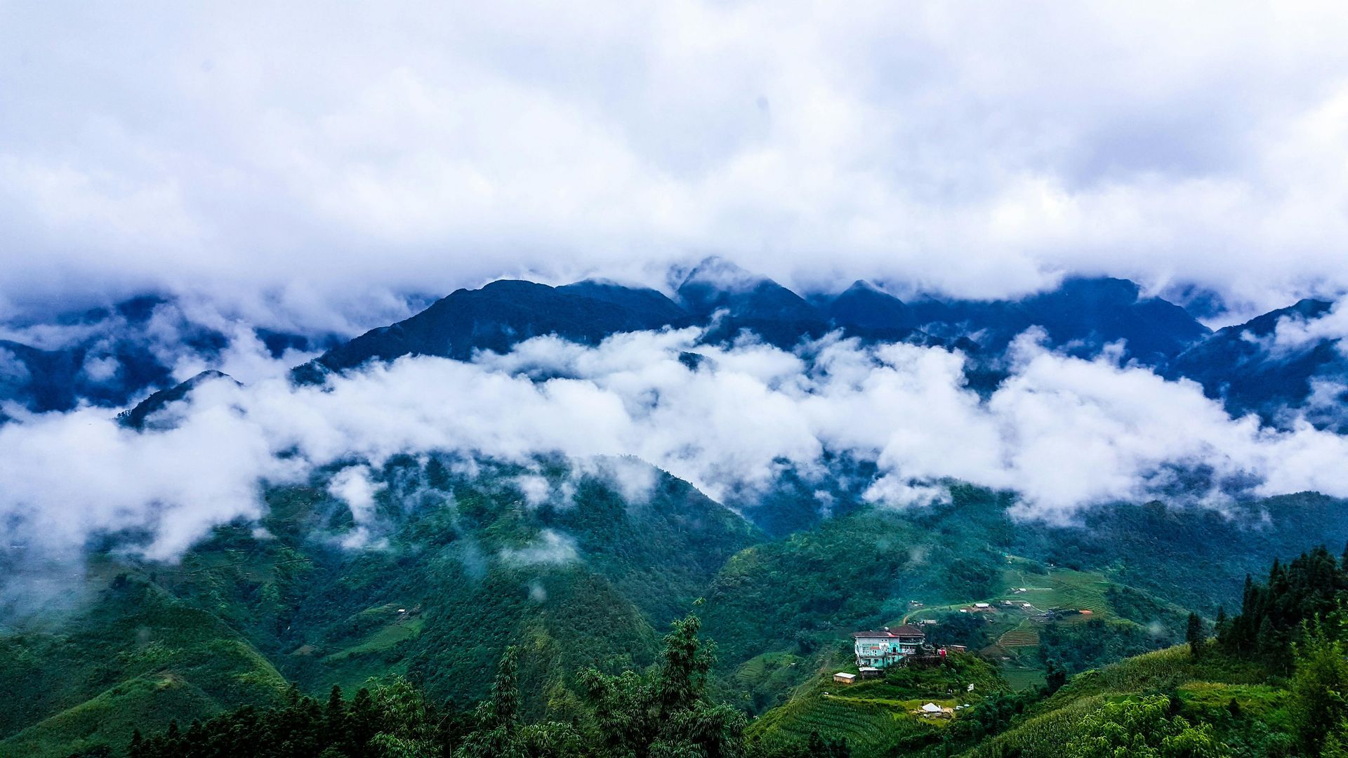 A view of a mountain covered in clouds on a cloudy day in Vietnam.