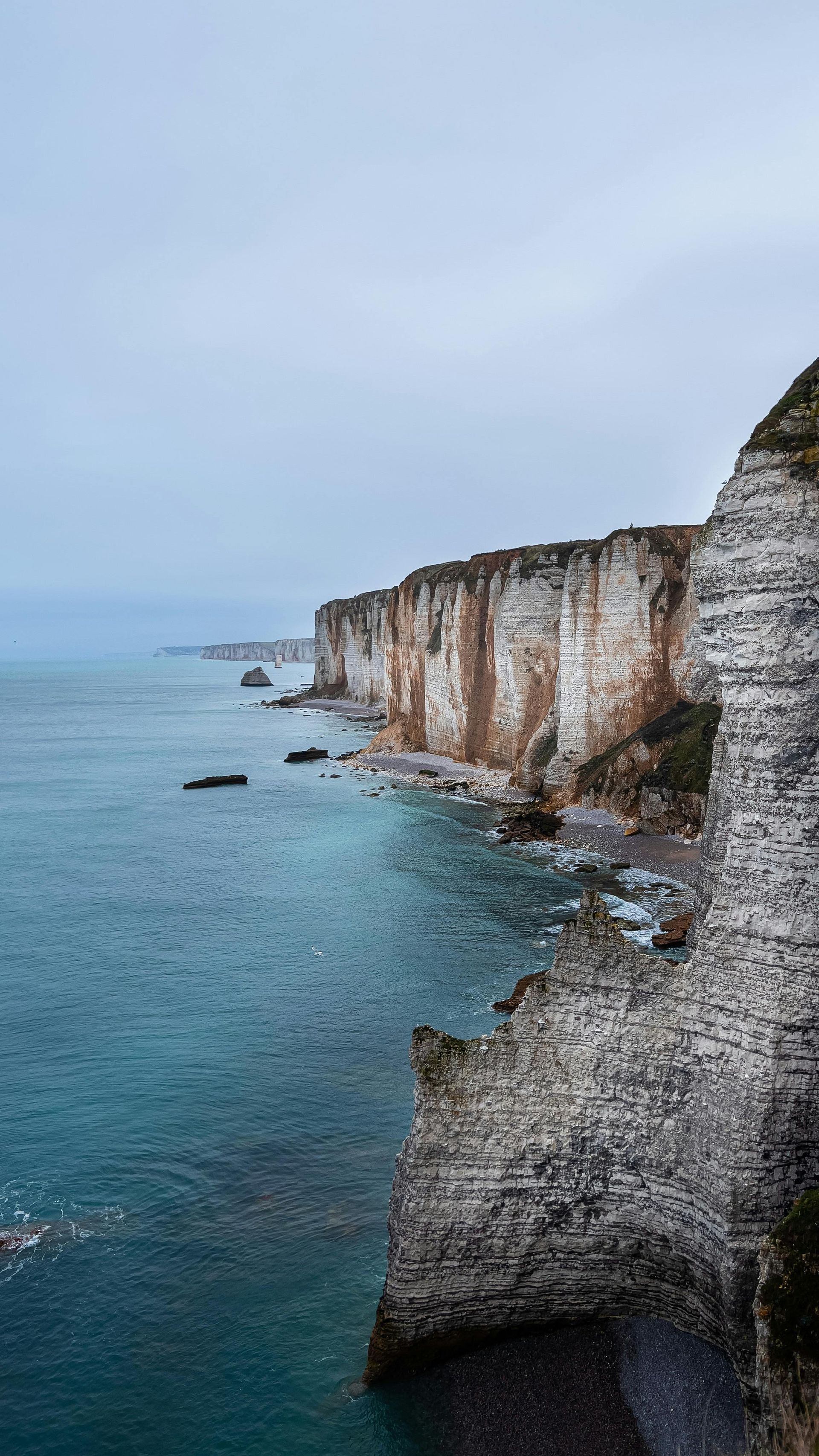 A view of the cliff Étretat overlooking the ocean in Normandy, France.