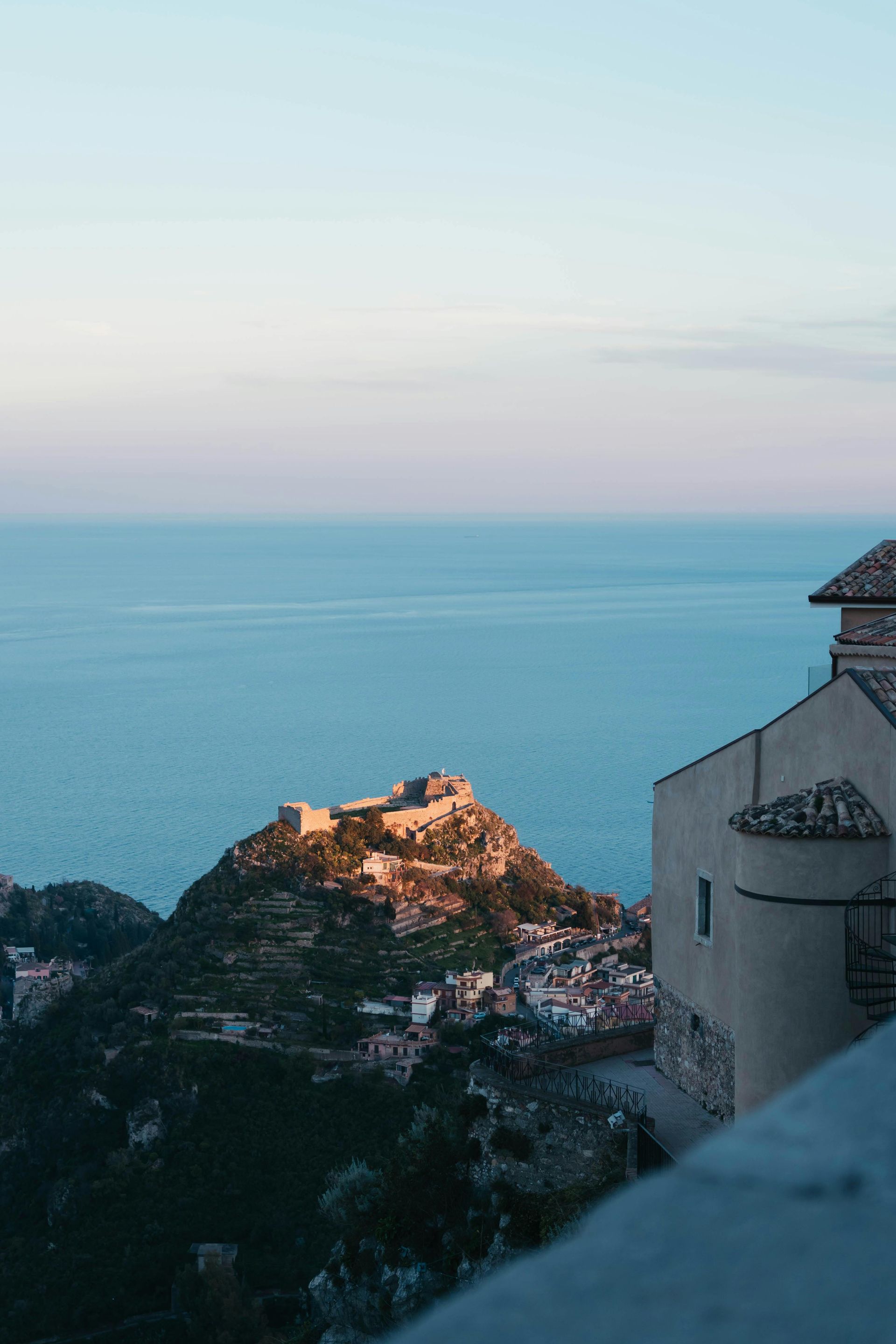 A view of Sicily, Italy from a cliff overlooking the ocean.