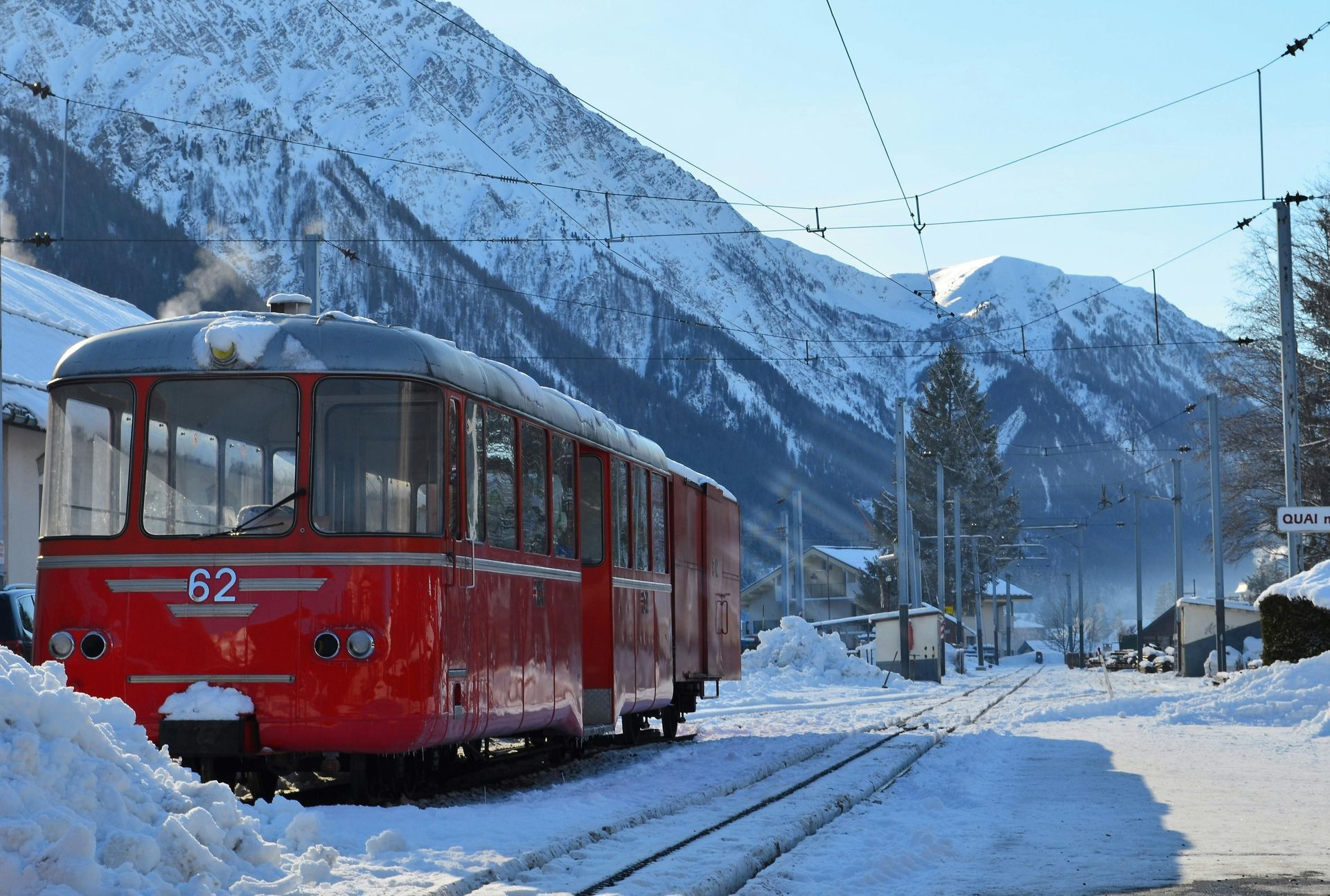 A red train with the number 82 on the front of it in Chamonix, France.