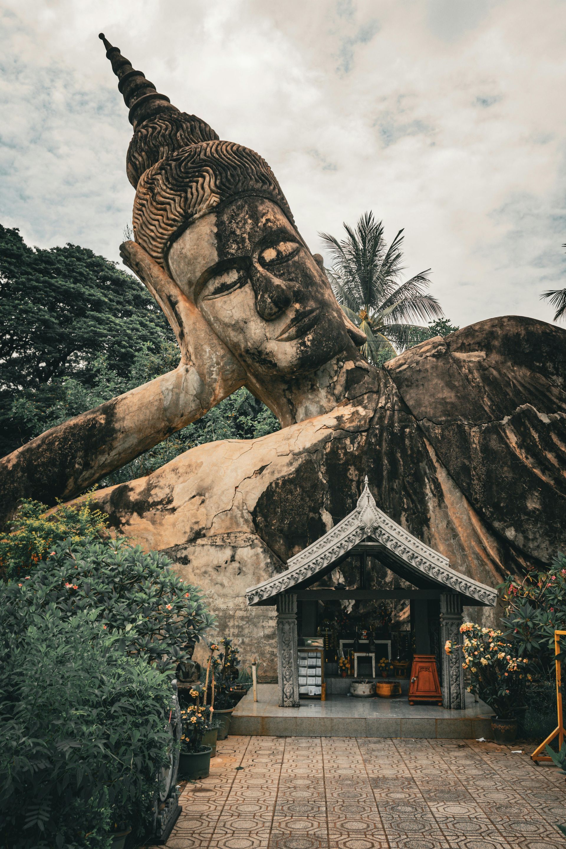 Statue in Buddha Park in the jungle of Laos.