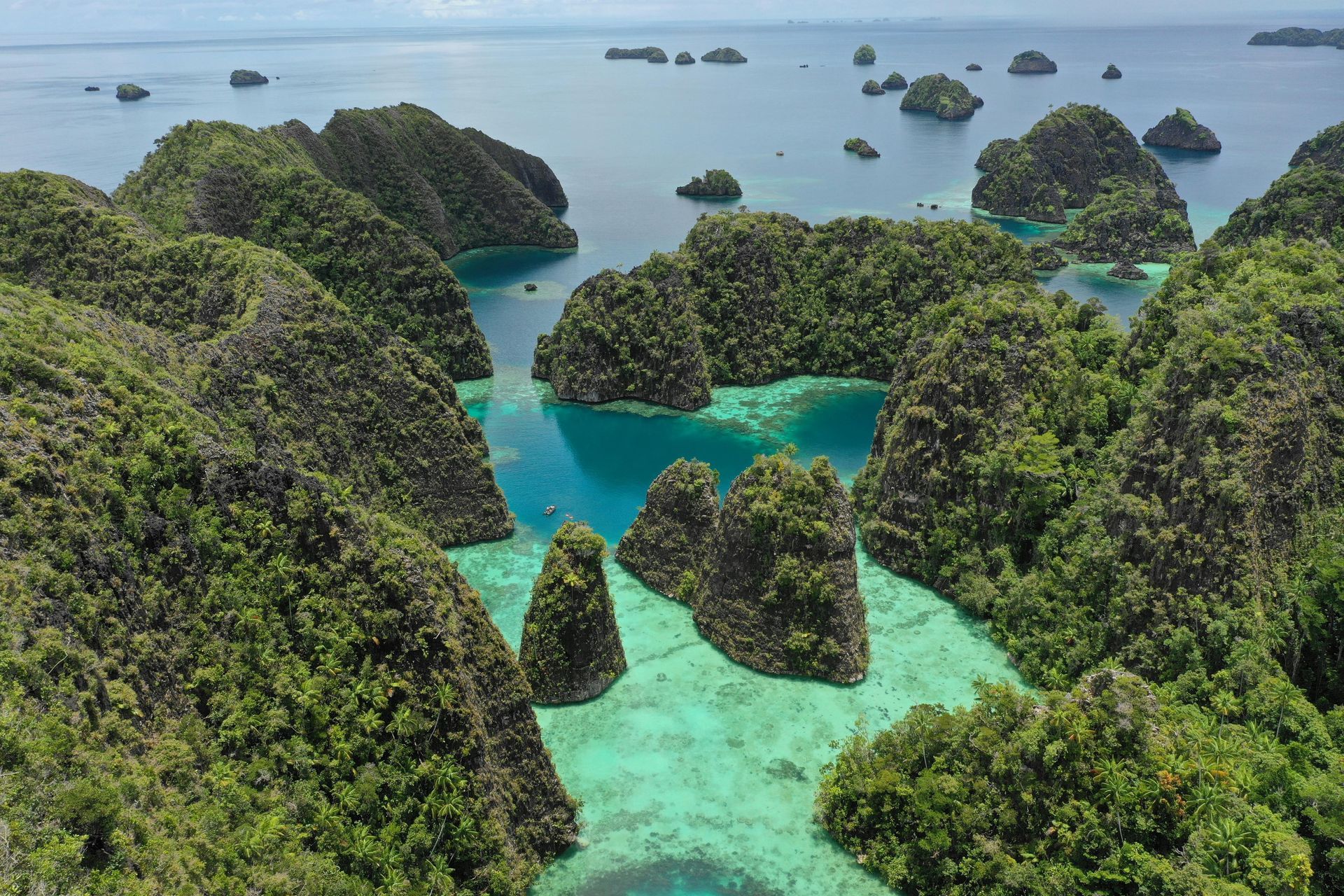 An aerial view of a coral reef surrounding the Raja Ampat islands in Indonesia.