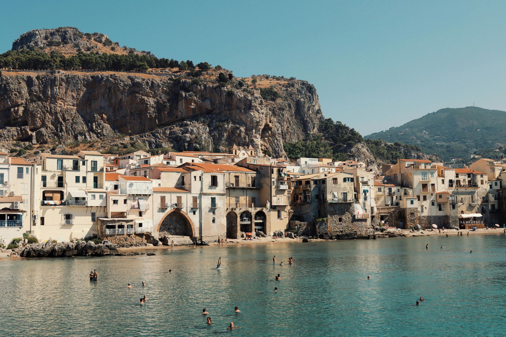 Sicily, Italy sits on the shore of a large body of water.