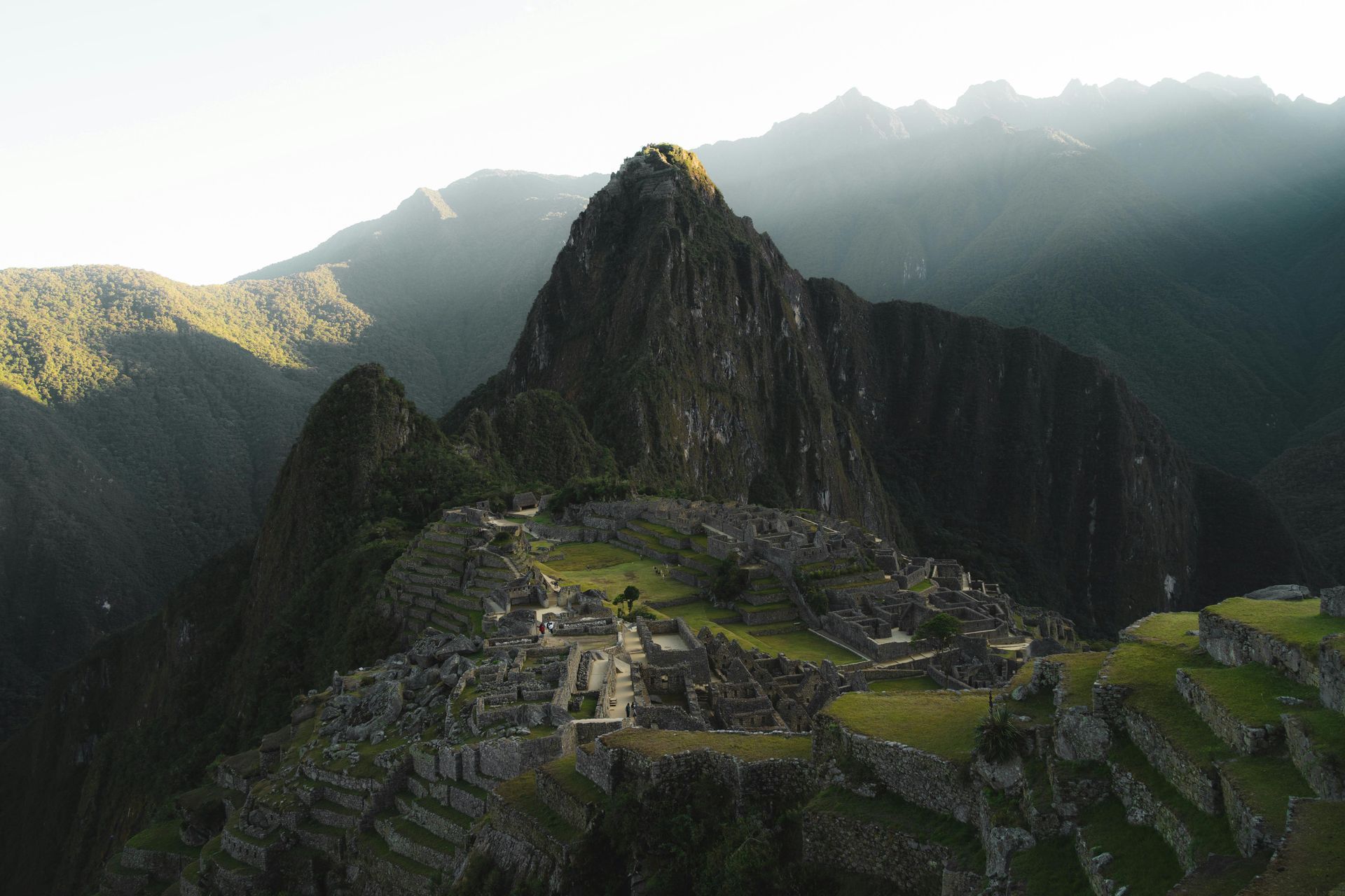 An aerial view of the ruins of Machu picchu in the mountains in Peru.