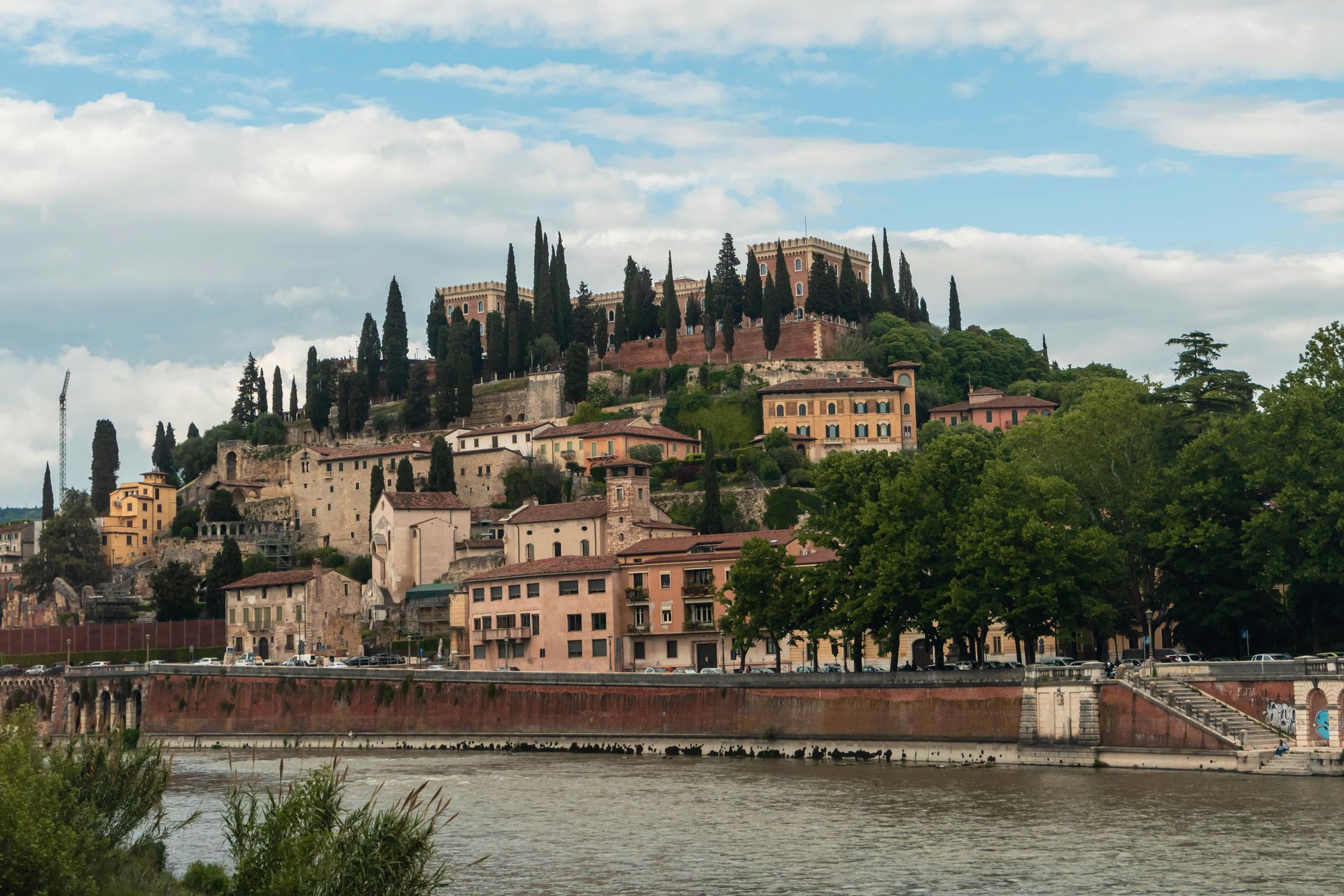 Verona, Italy sits on a hill overlooking a body of water