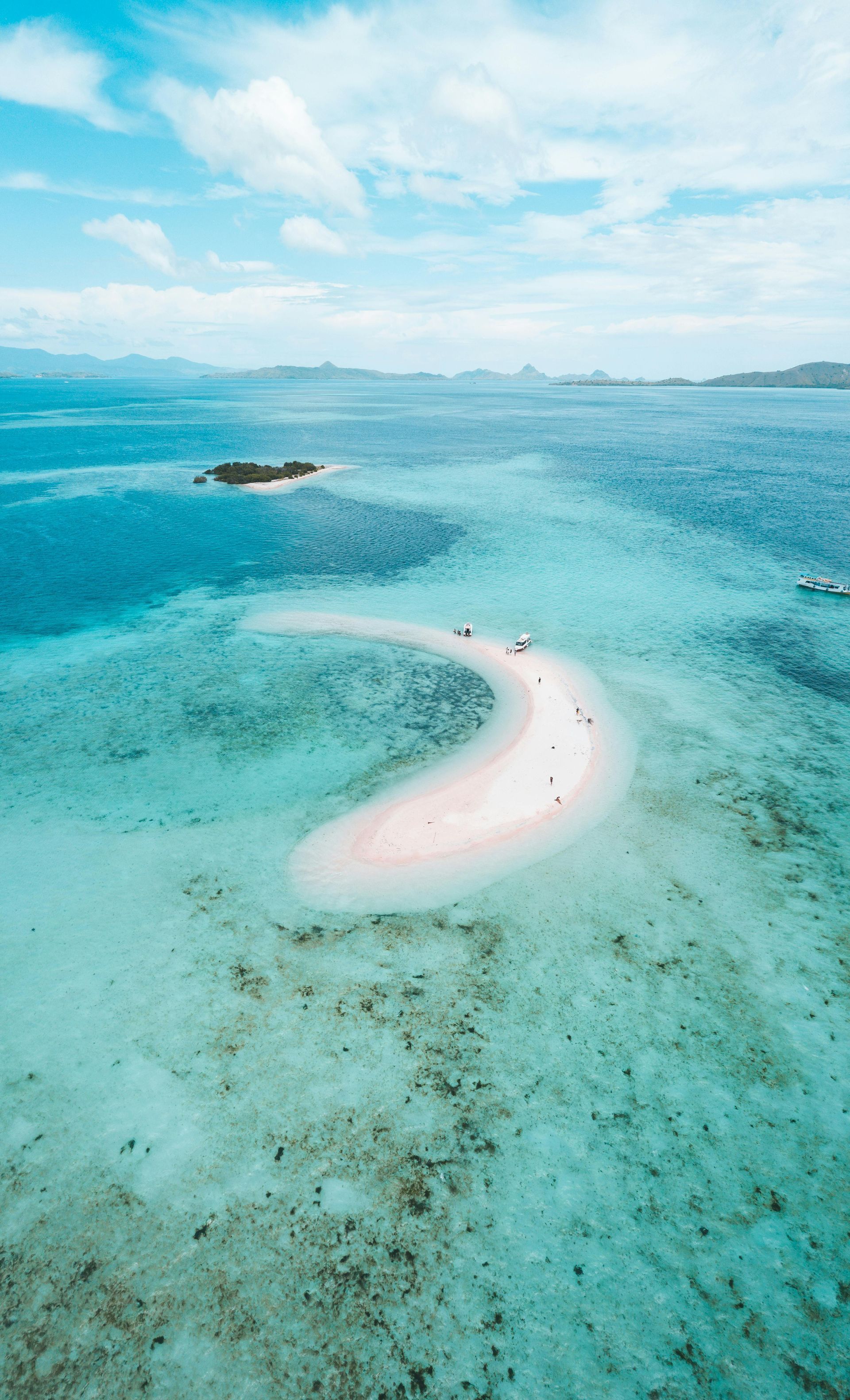 An aerial view of a small island in the middle of the ocean in Indonesia.