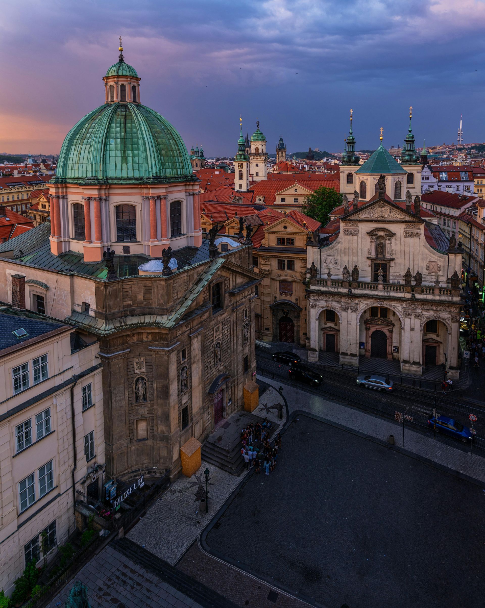 An aerial view of Prague with a dome on top of a building.