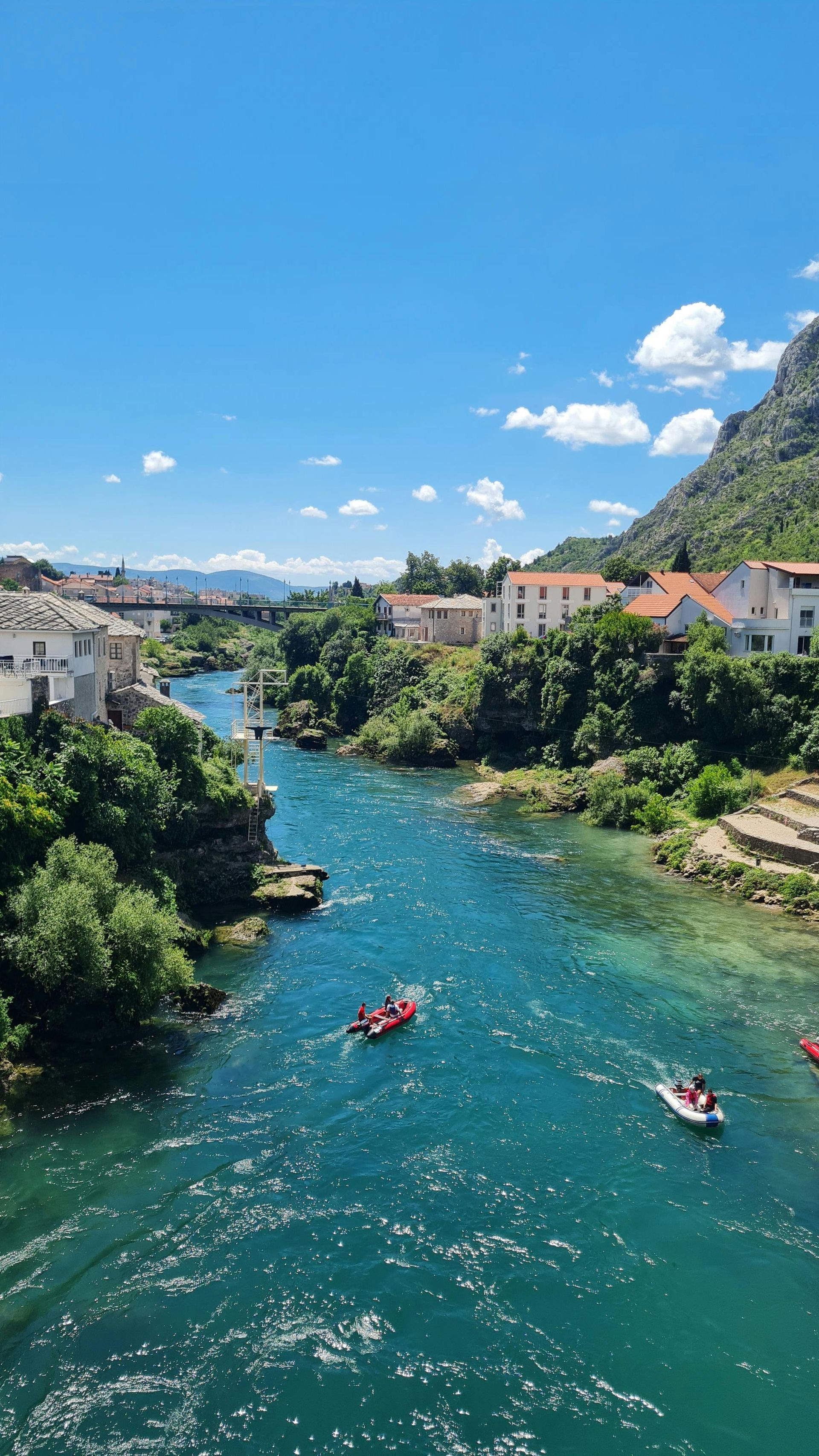 A group of people are kayaking down River Neretva in Mostar, Bosnia and Herzegovina.