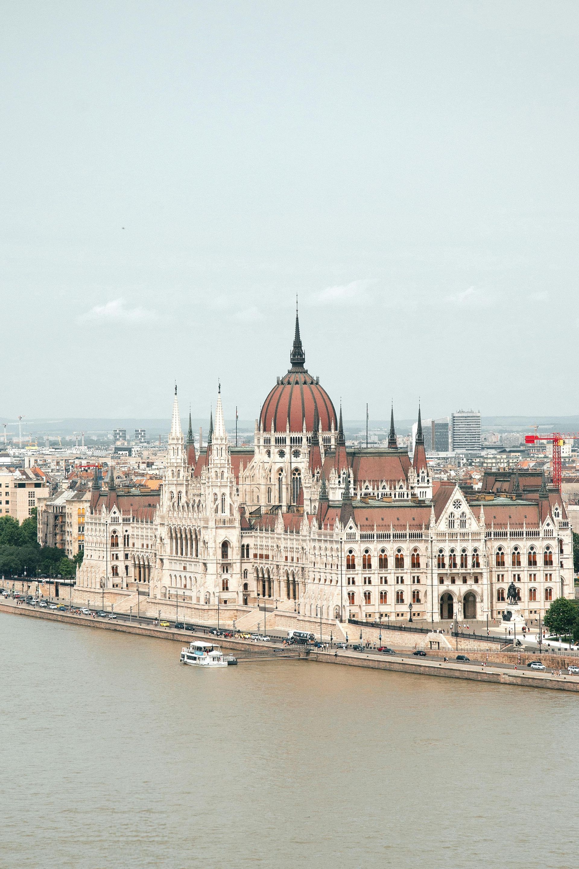 An aerial view of the Hungarian Parliament Building next to the Danube River in Budapest, Hungary.