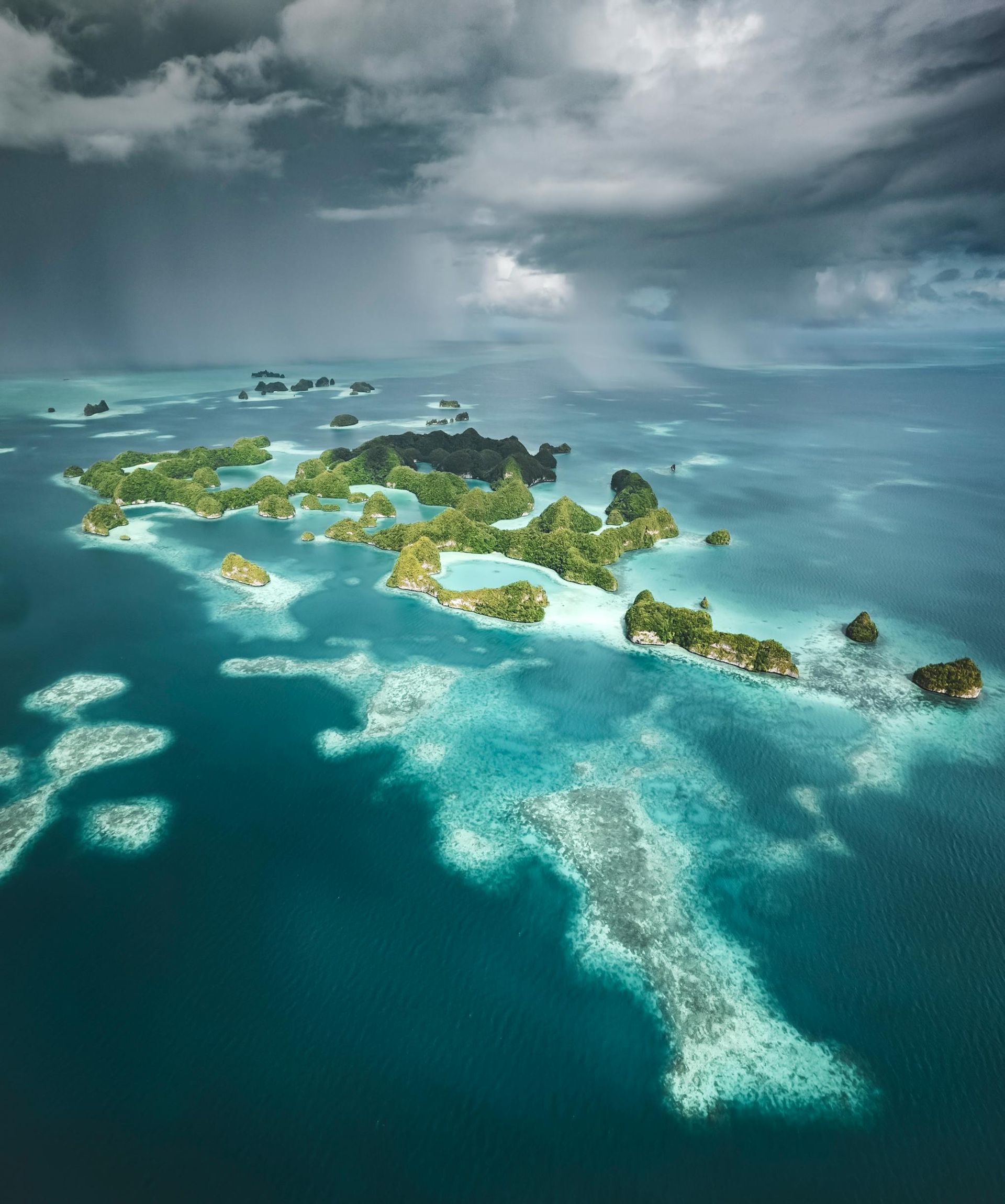 An aerial view of the Cook Islands in the middle of the ocean.