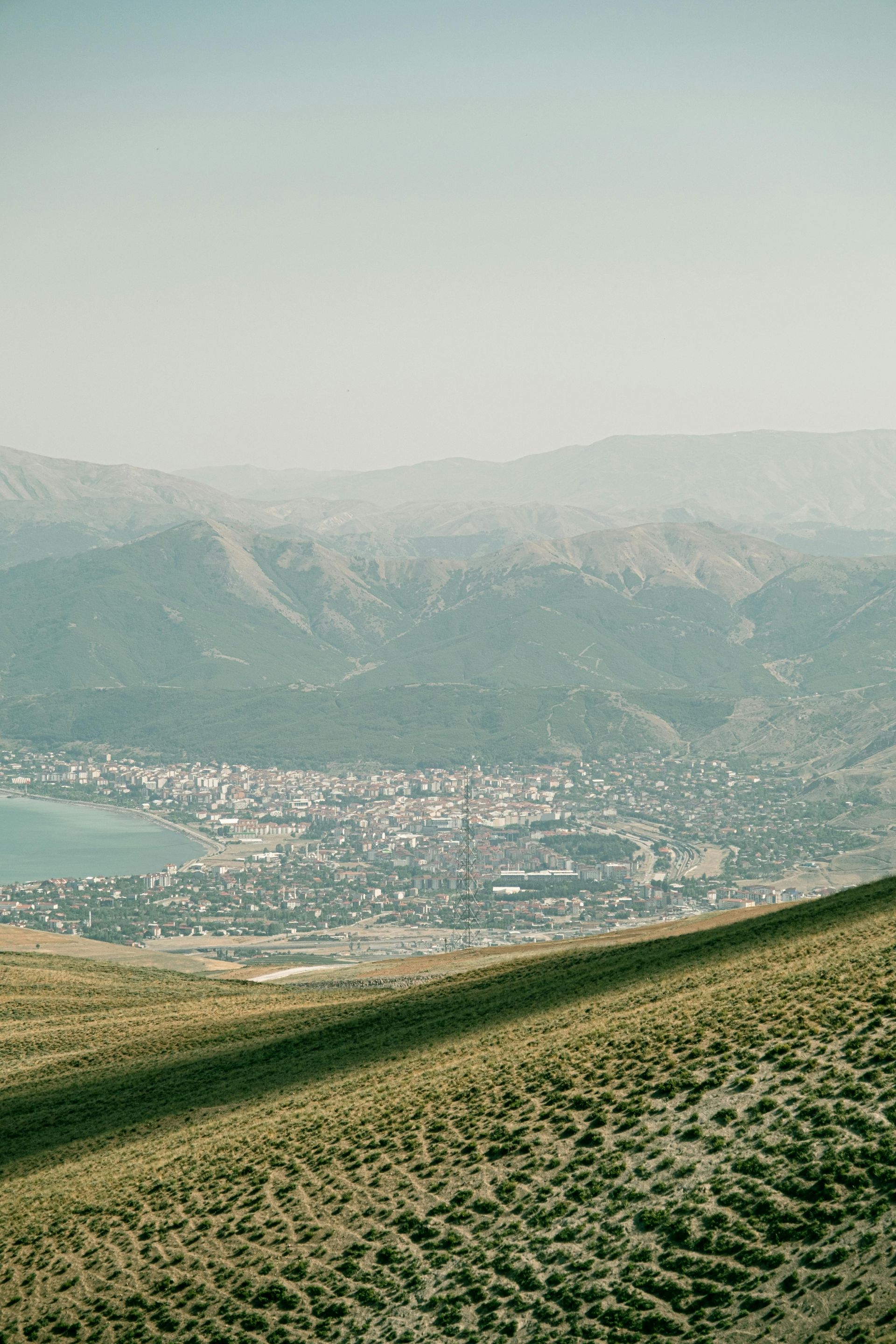 A view of a city from the top of a mountain in Switzerland.