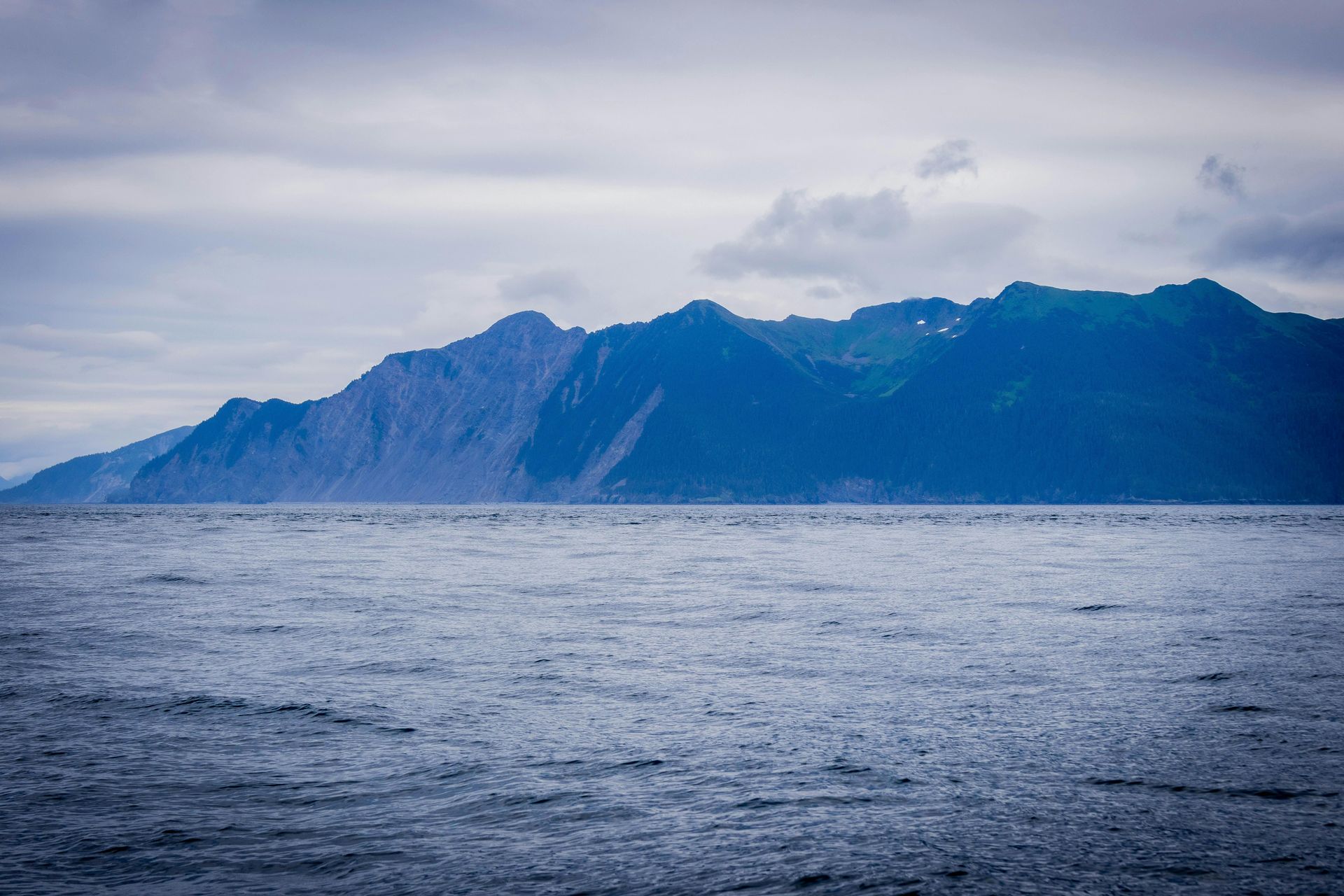 A large body of water with mountains in the background in Alaska. 