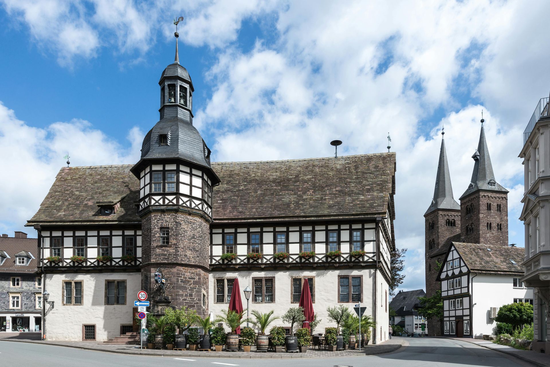 A large building with a clock tower on top of it on The Rhine River.