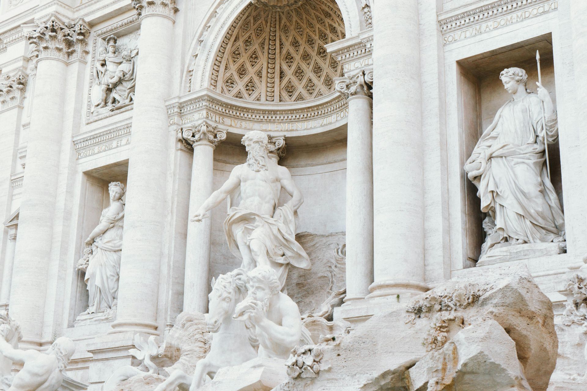 A white statue an The Trevi Fountain in Rome, Italy.