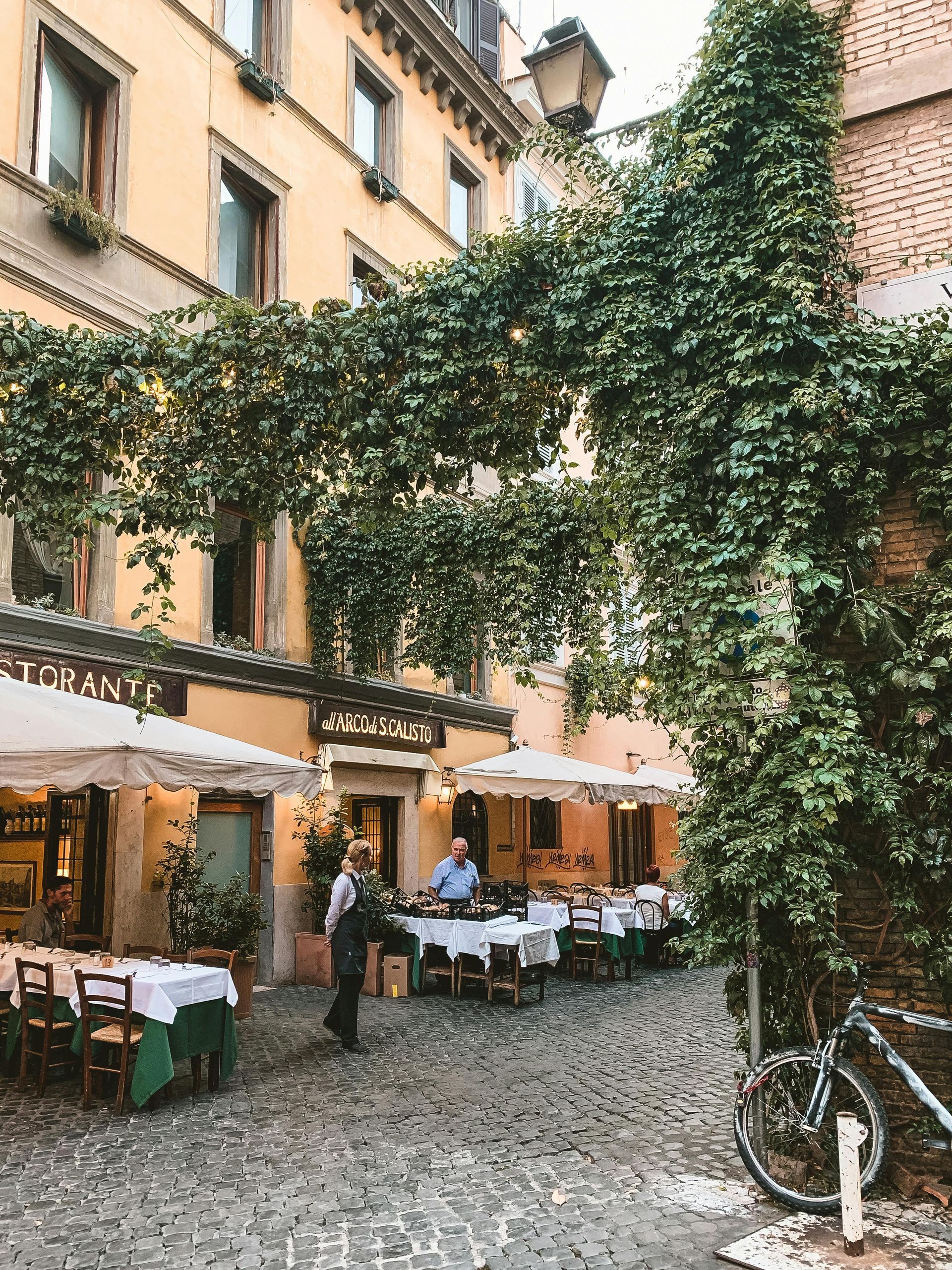 A restaurant with tables and  in Rome, Italy.