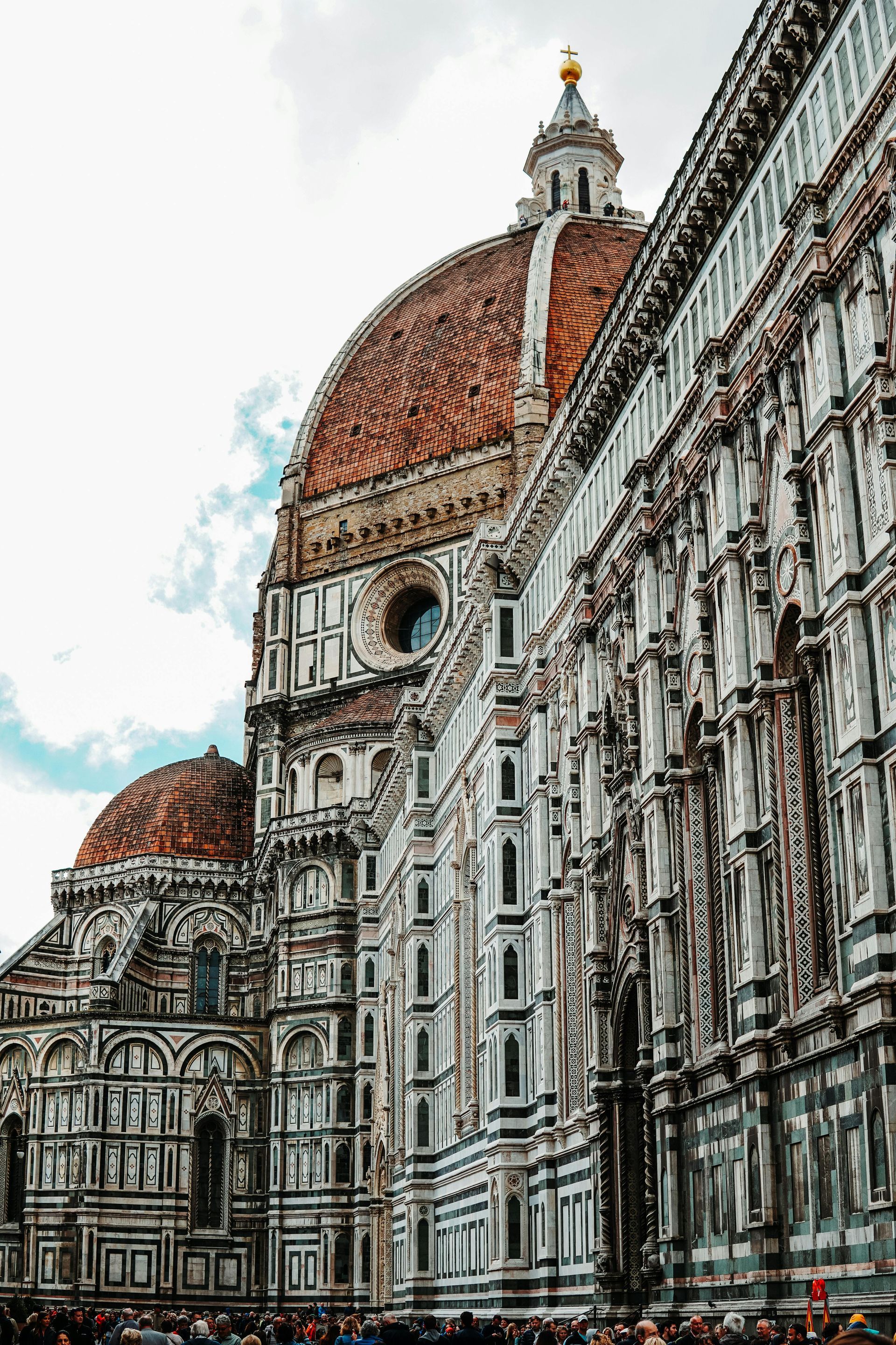 A large building with a dome on top of it in Florence, Italy.