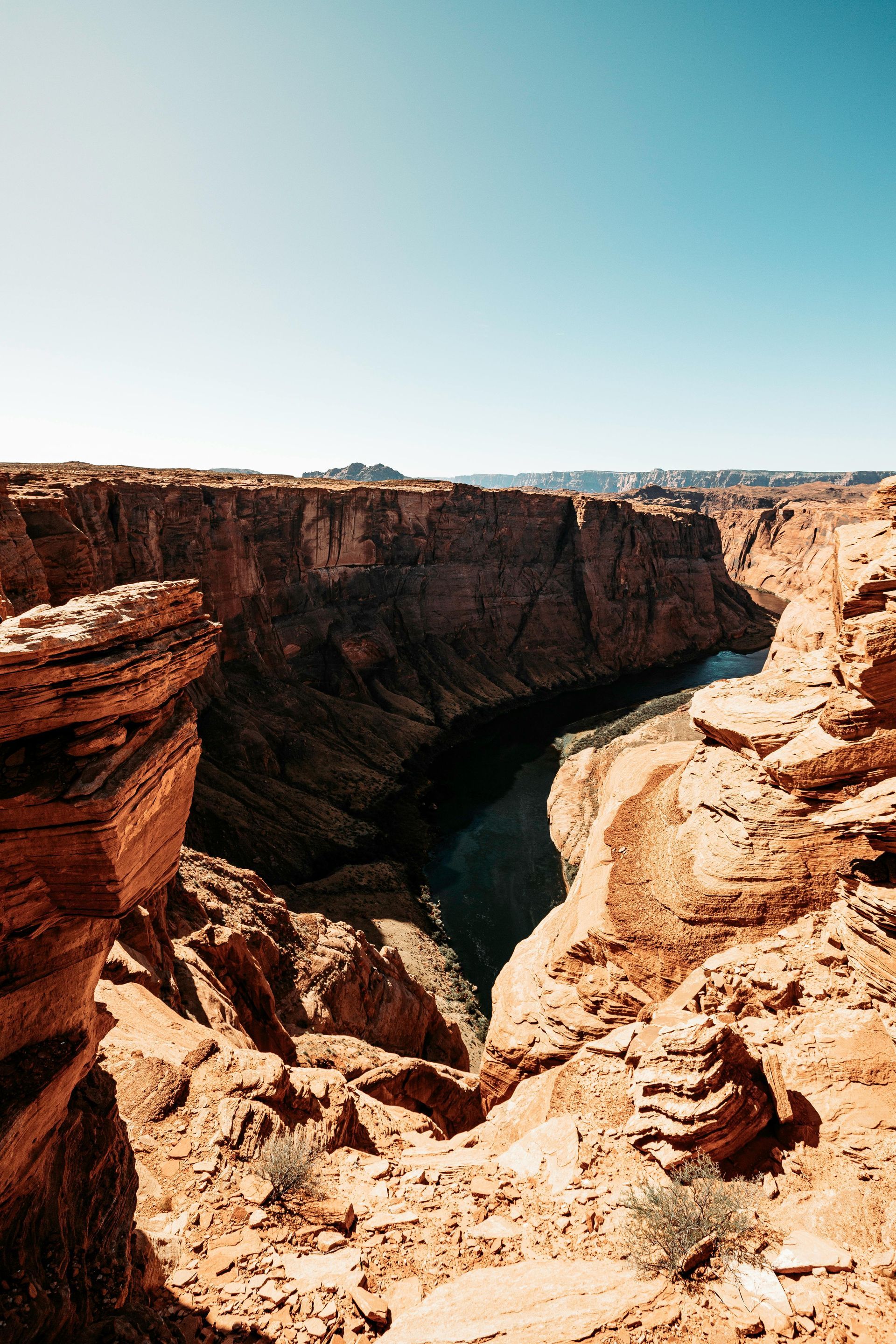 A river runs through a canyon between two rocky cliffs at Grand Canyon National Park in Arizona.