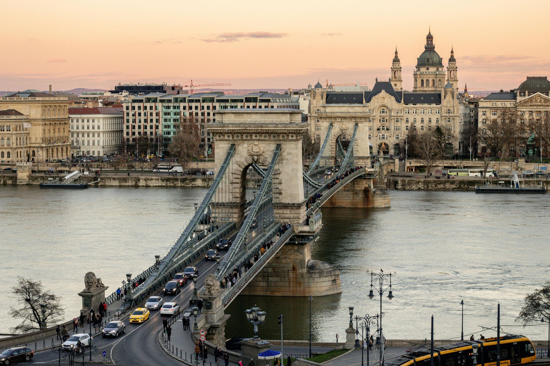 The Széchenyi Chain Bridge over The Danube River with Budapest in the background.