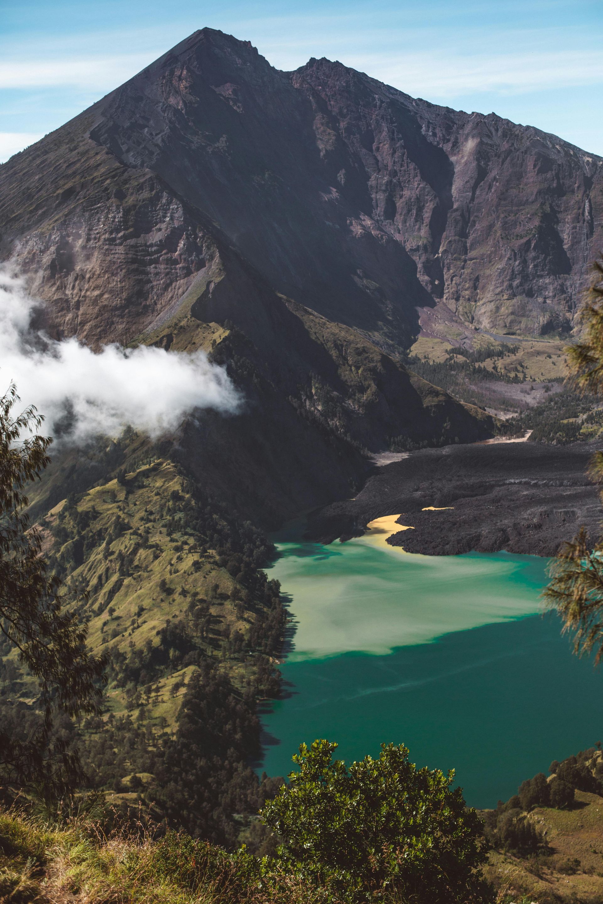 A mountain with a lake in the middle of it in Indonesia.