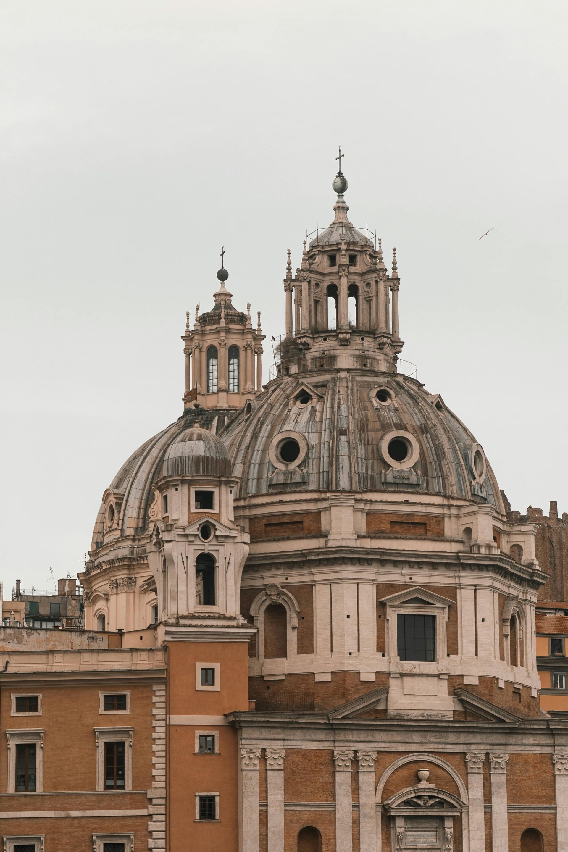 A dome shaped building with two towers on top of it in Rome, Italy.