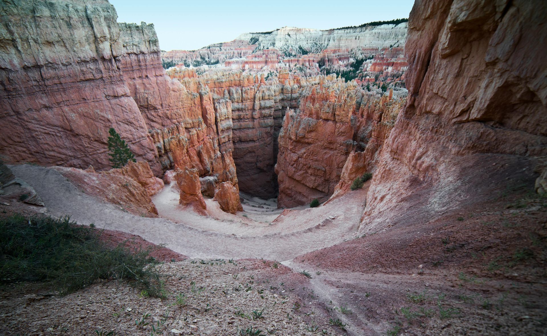 A view of a canyon from the top of a cliff at Bryce Canyon National Park in Utah.