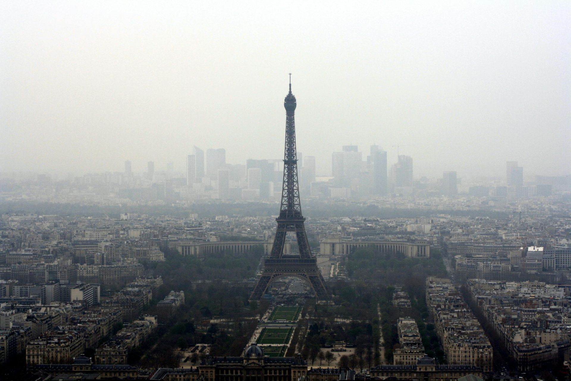 An aerial view of the eiffel tower in paris on a foggy day.