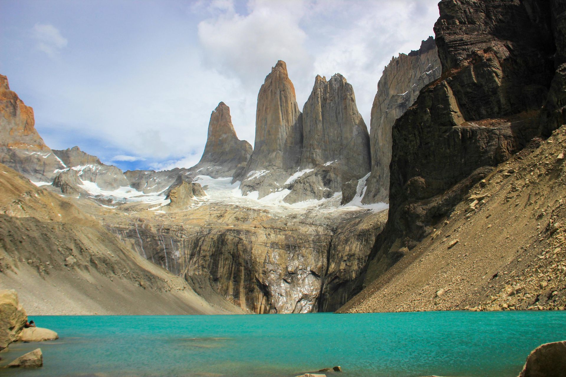 A mountain range with a lake in the middle of it  in Antarctica.