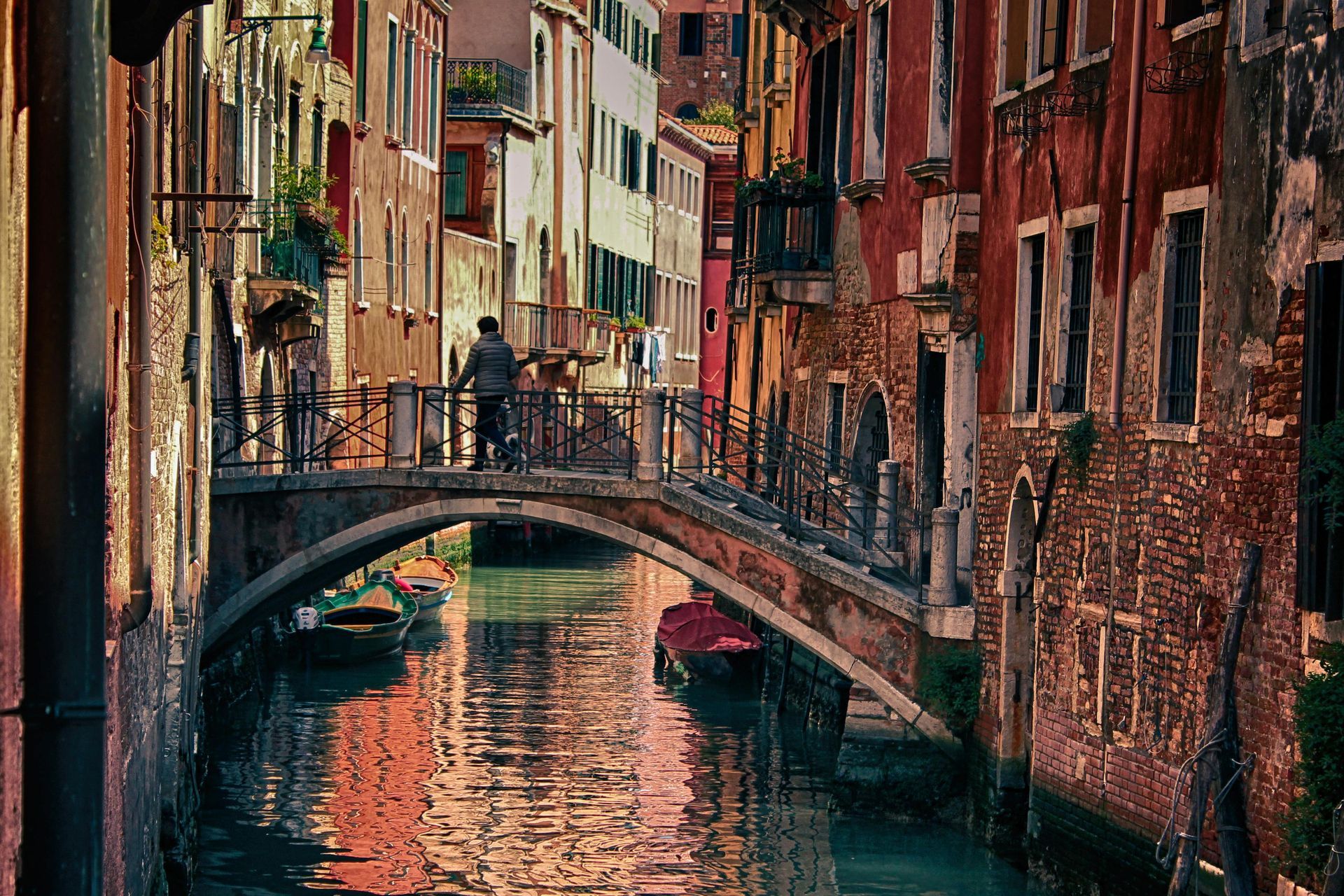 A canal in venice with a bridge over it