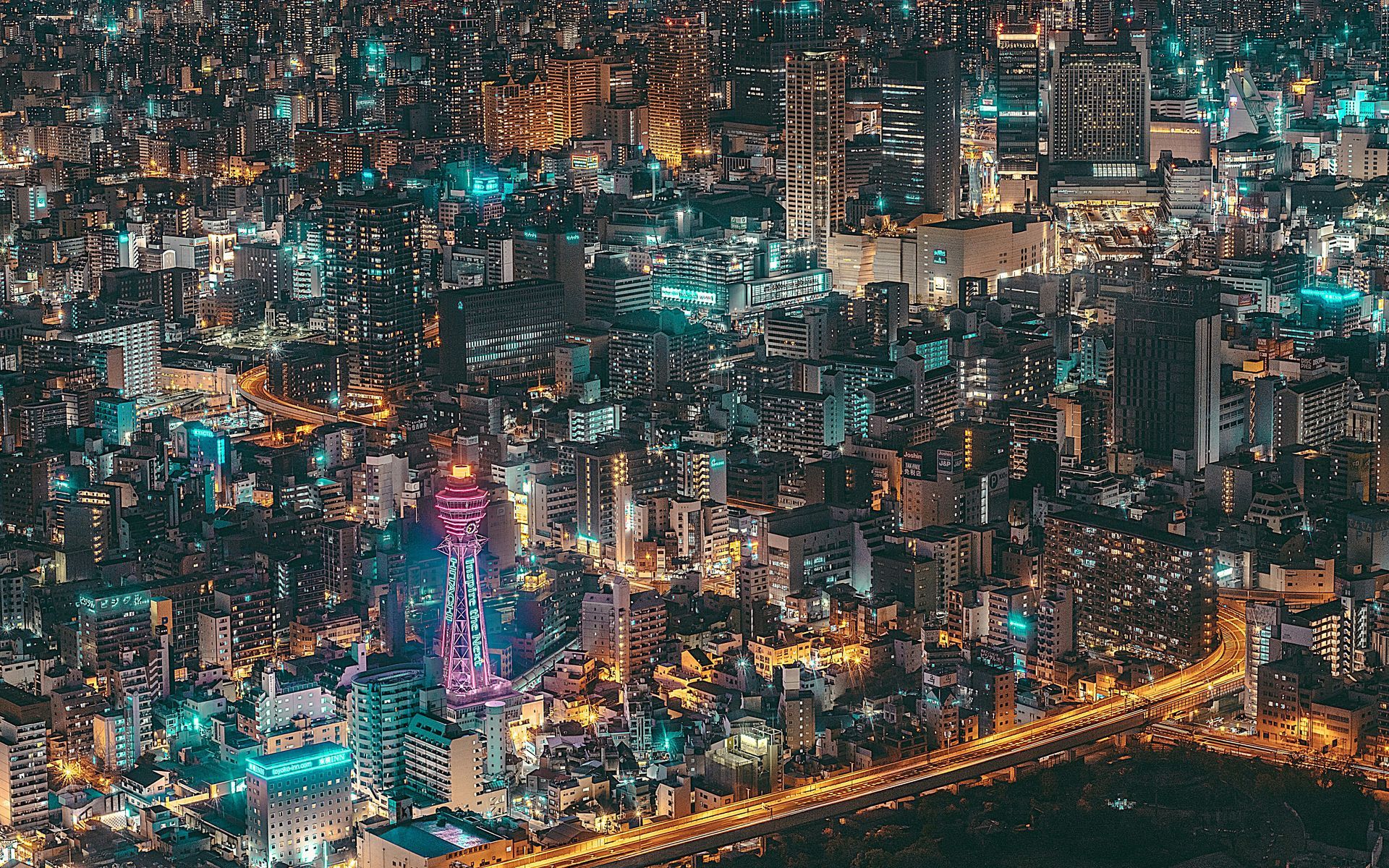 Osaka skyline at night illuminated by colorful lights in Japan.