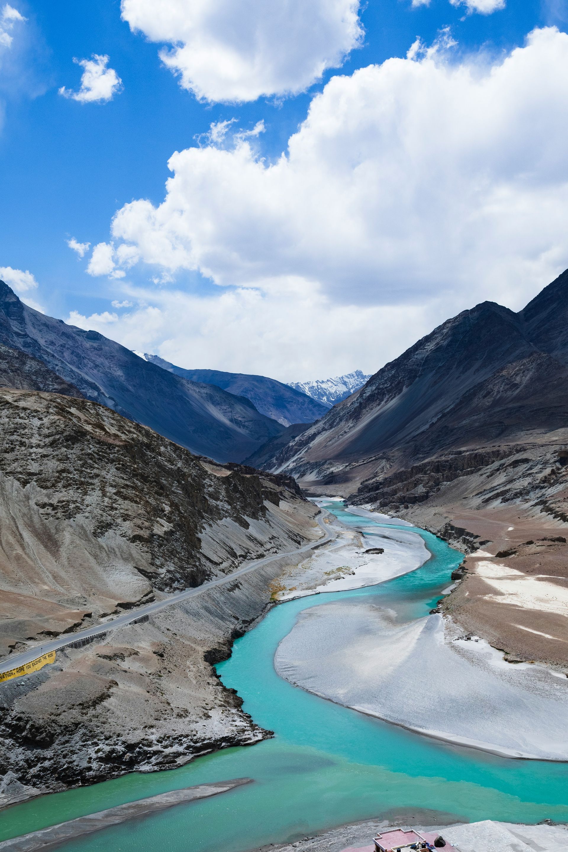 Turquoise river flows through a mountain valley in Ladakh, India.