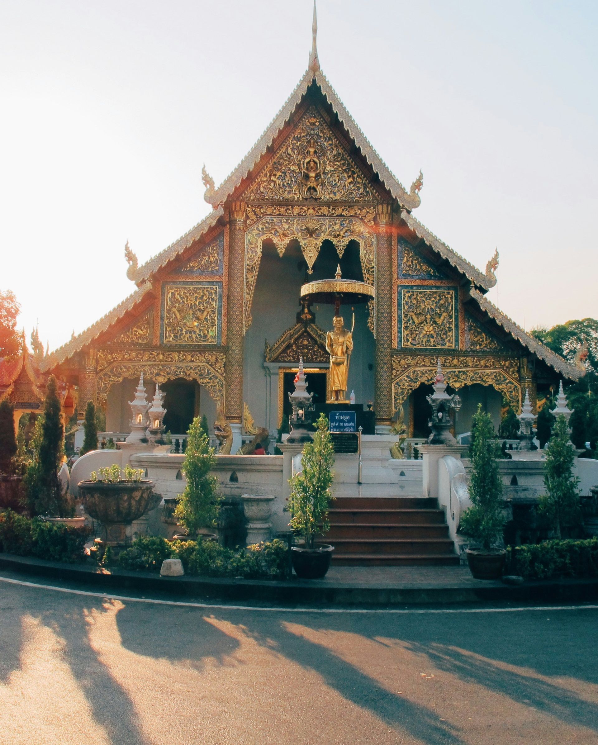 A very ornate building with a statue on top of it in Chiang Mai, Thailand.