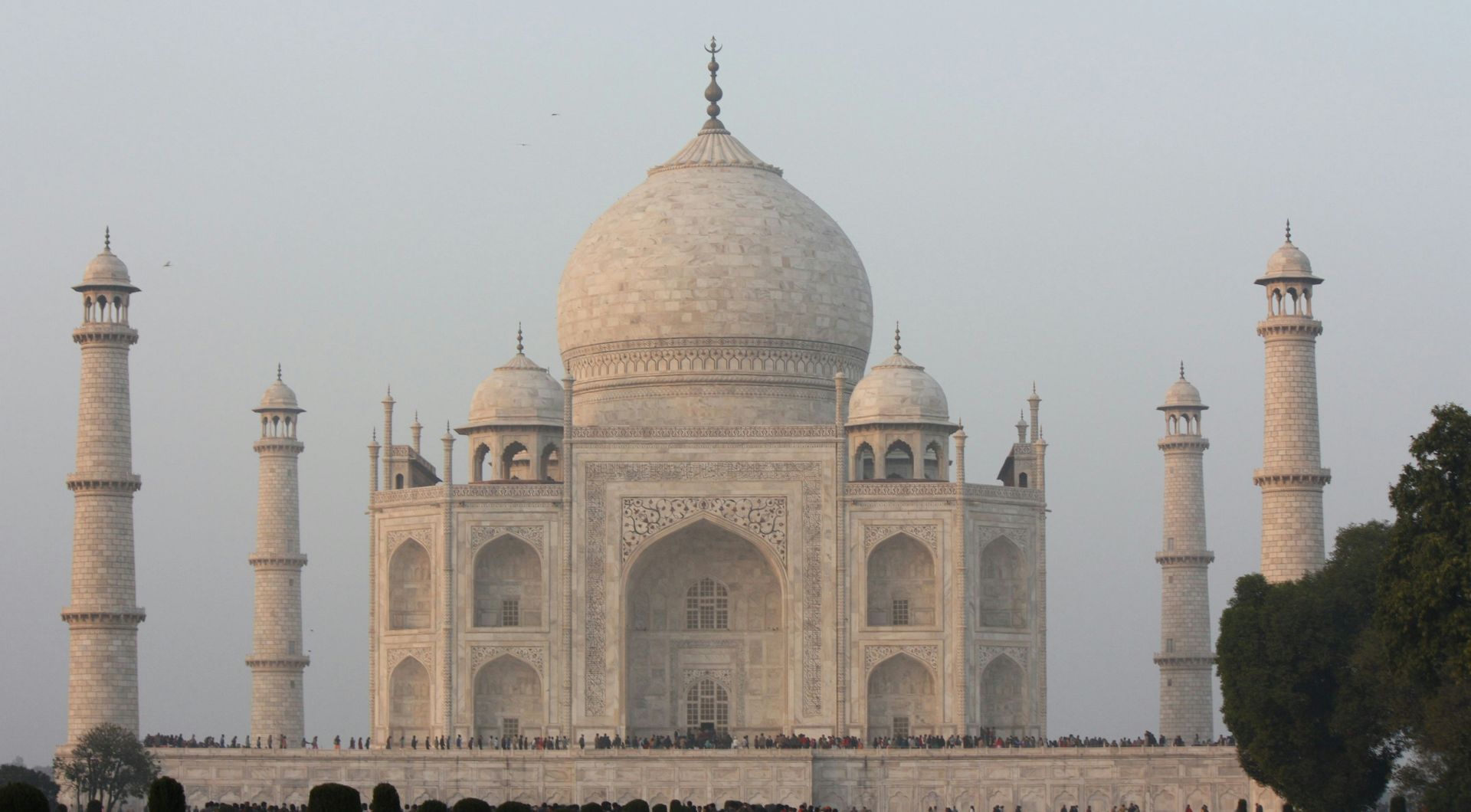 Taj Mahal, white marble mausoleum in Agra, India, with four minarets.