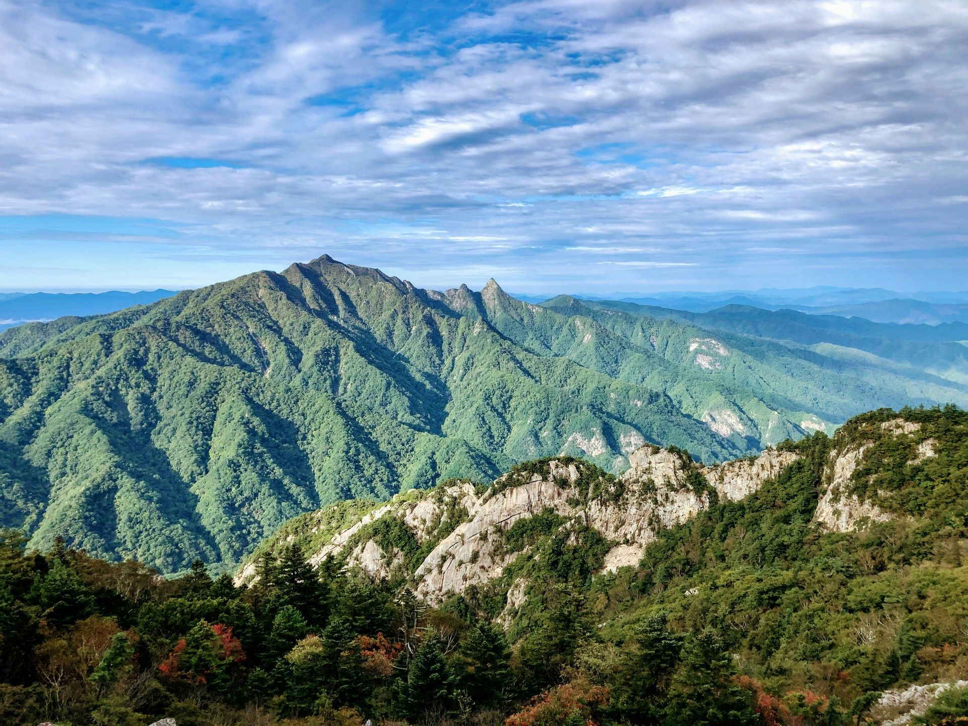 Mountain range with green, tree-covered slopes in Seoraksan National Park, South Korea.