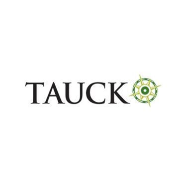 A logo for Tauck with a green compass on a white background.